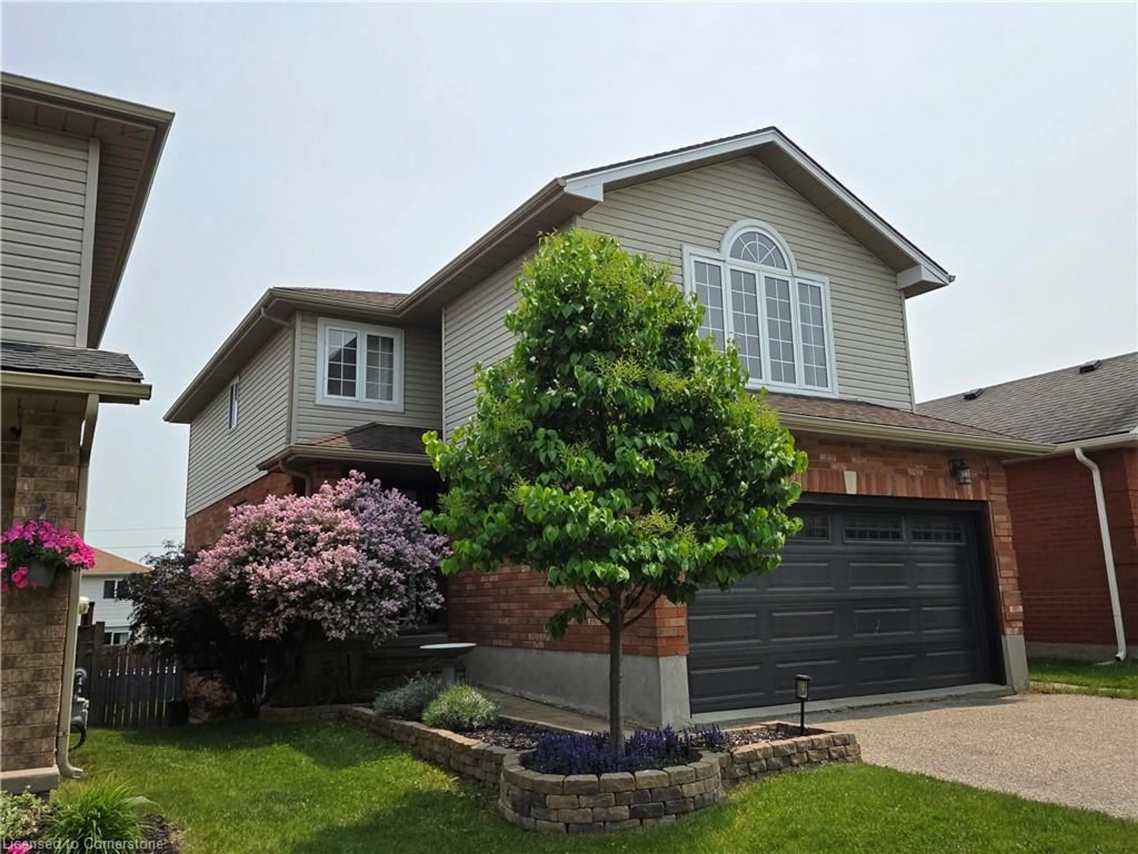 Home with brick exterior material, street for 10 Queen Charlotte Cres, Kitchener Ontario N2E 3N5