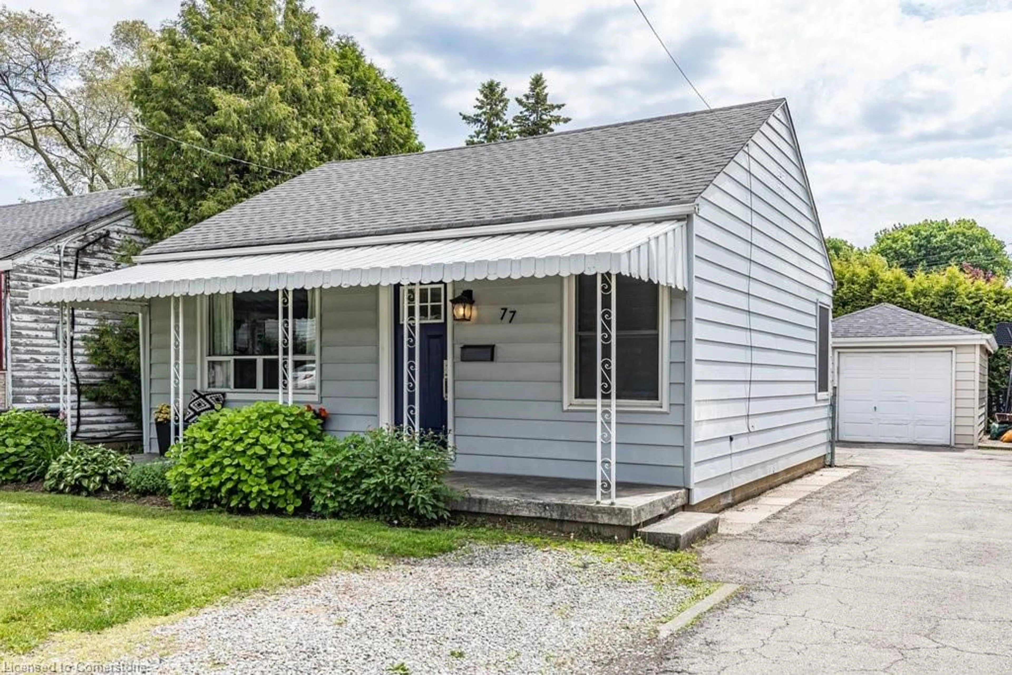 Home with vinyl exterior material, street for 77 East 31st St, Hamilton Ontario L8V 3N9