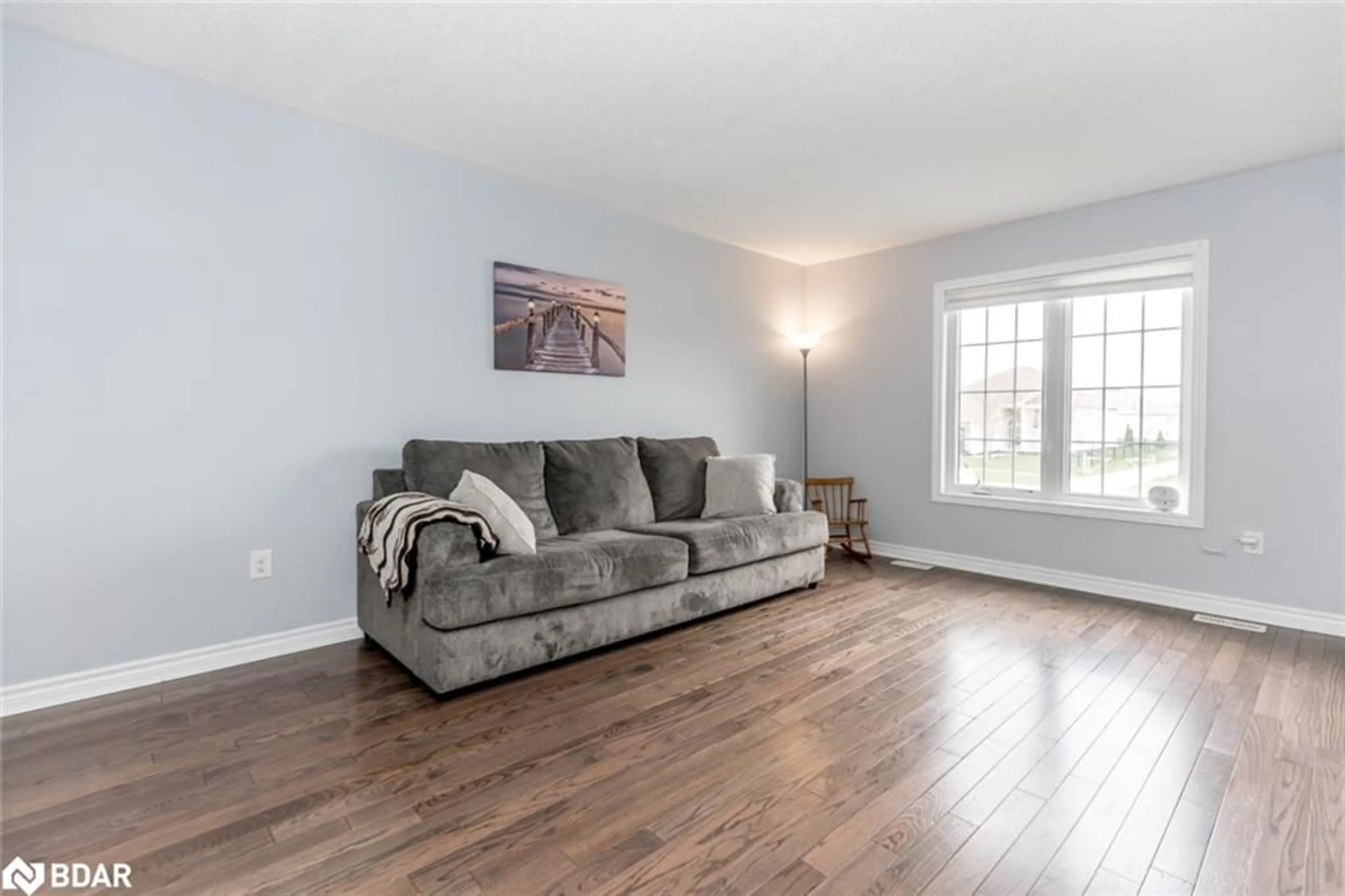 Living room with furniture, wood/laminate floor for 283 Regina St, Stayner Ontario L0M 1S0