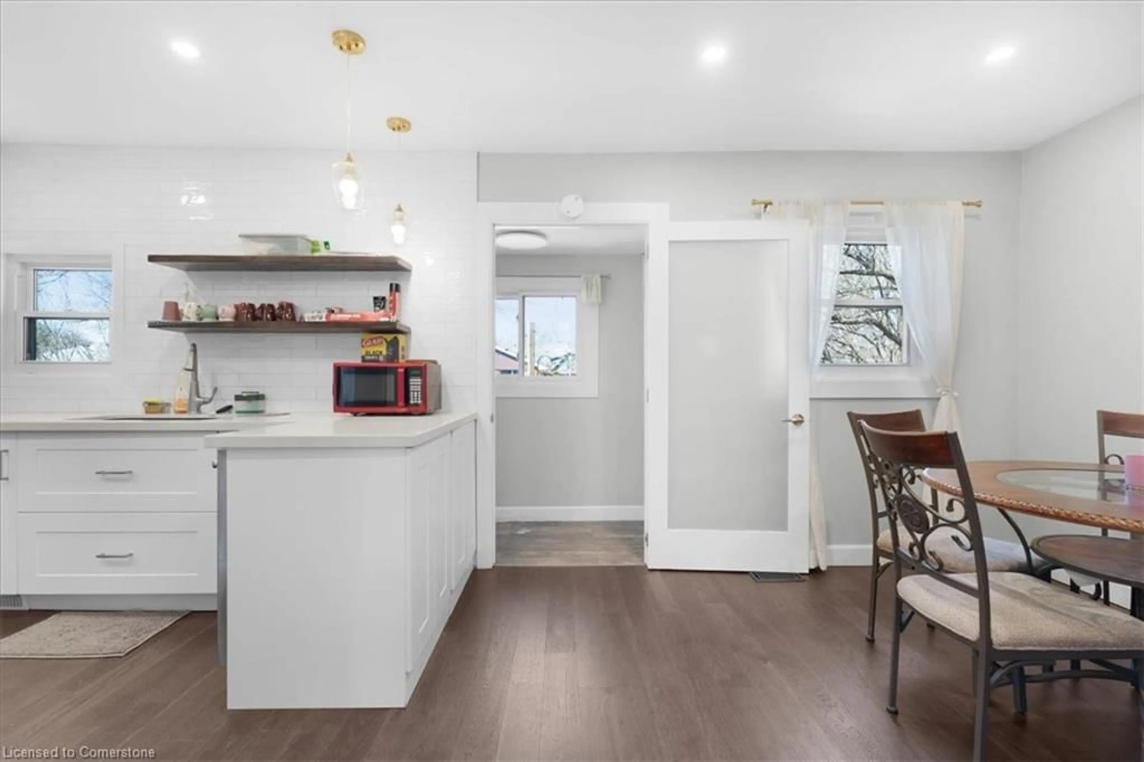 Open concept kitchen, wood/laminate floor for 86 East 19th St, Hamilton Ontario L9A 4S1