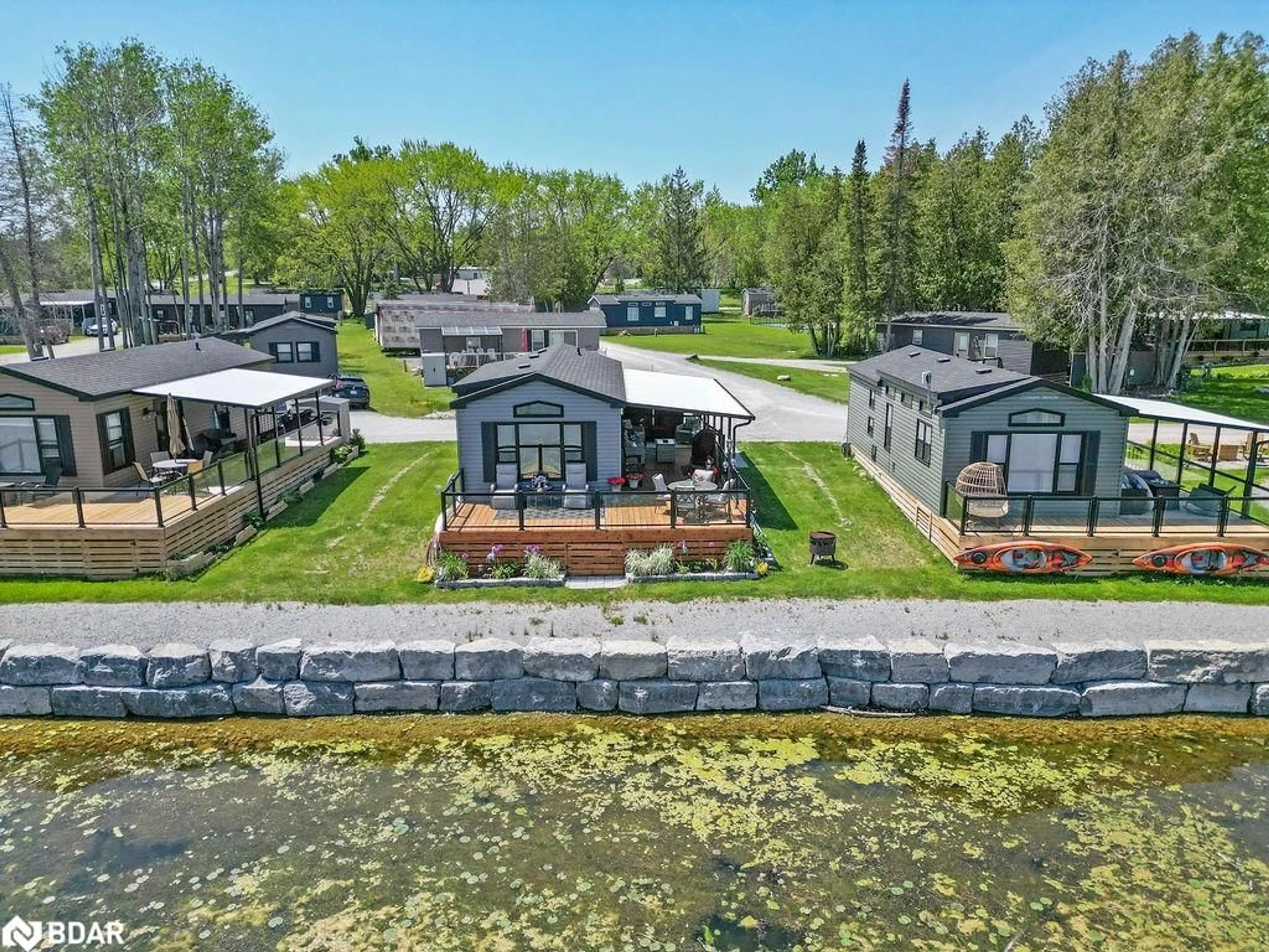 A pic from outside/outdoor area/front of a property/back of a property/a pic from drone, water/lake/river/ocean view for 657 Thunder Bridge Rd #W4, Lindsay Ontario K9V 4R1