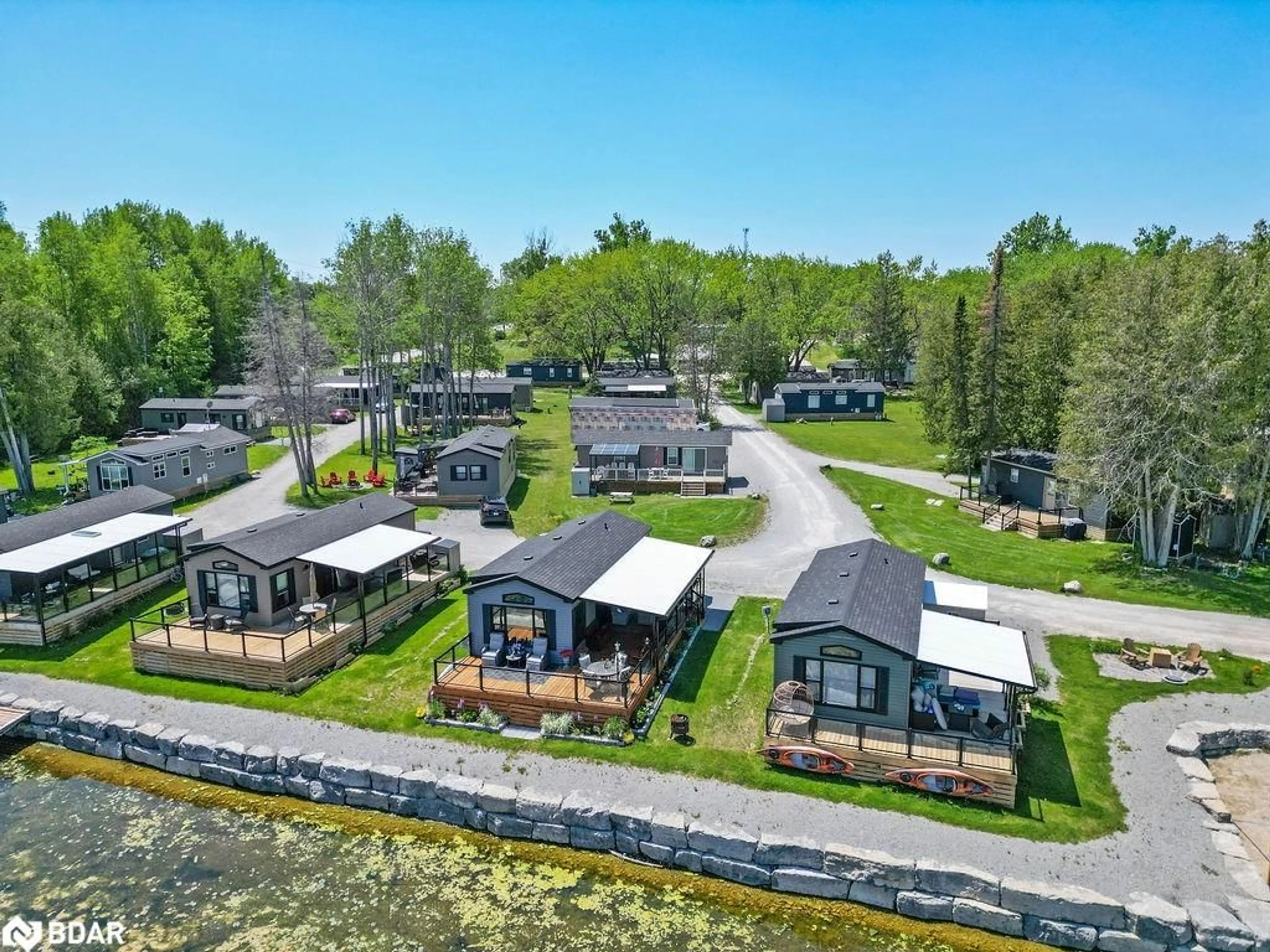 A pic from outside/outdoor area/front of a property/back of a property/a pic from drone, water/lake/river/ocean view for 657 Thunder Bridge Rd #W4, Lindsay Ontario K9V 4R1