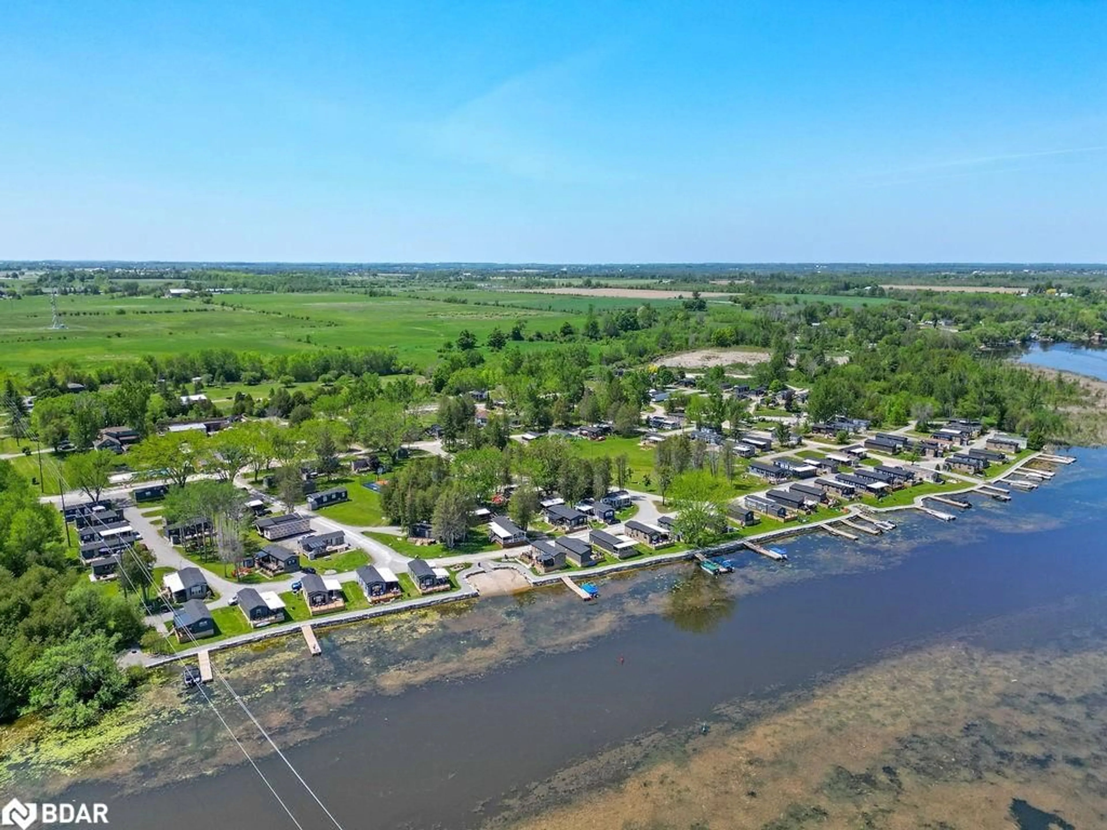 A pic from outside/outdoor area/front of a property/back of a property/a pic from drone, water/lake/river/ocean view for 657 Thunder Bridge Rd #W4, Lindsay Ontario K9V 4R1