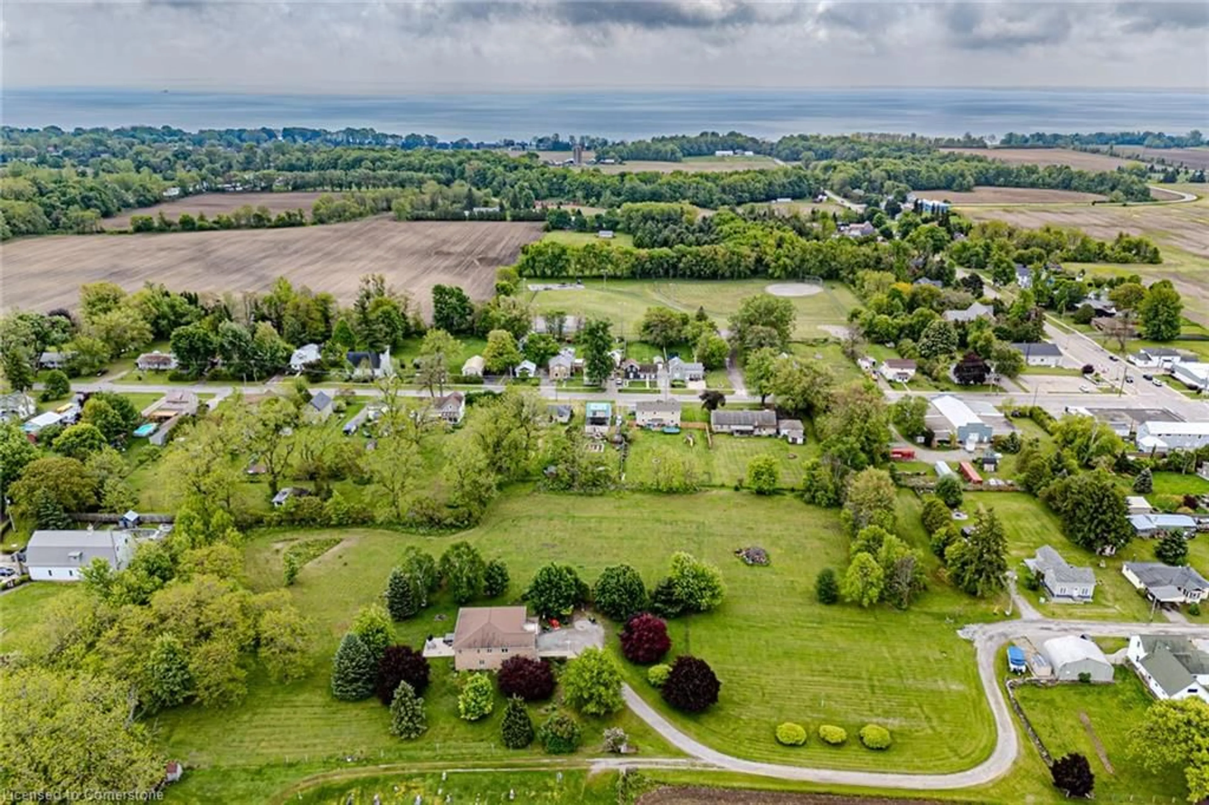 A pic from outside/outdoor area/front of a property/back of a property/a pic from drone, water/lake/river/ocean view for 18 Neal Lane, St. Williams Ontario N0E 1P0