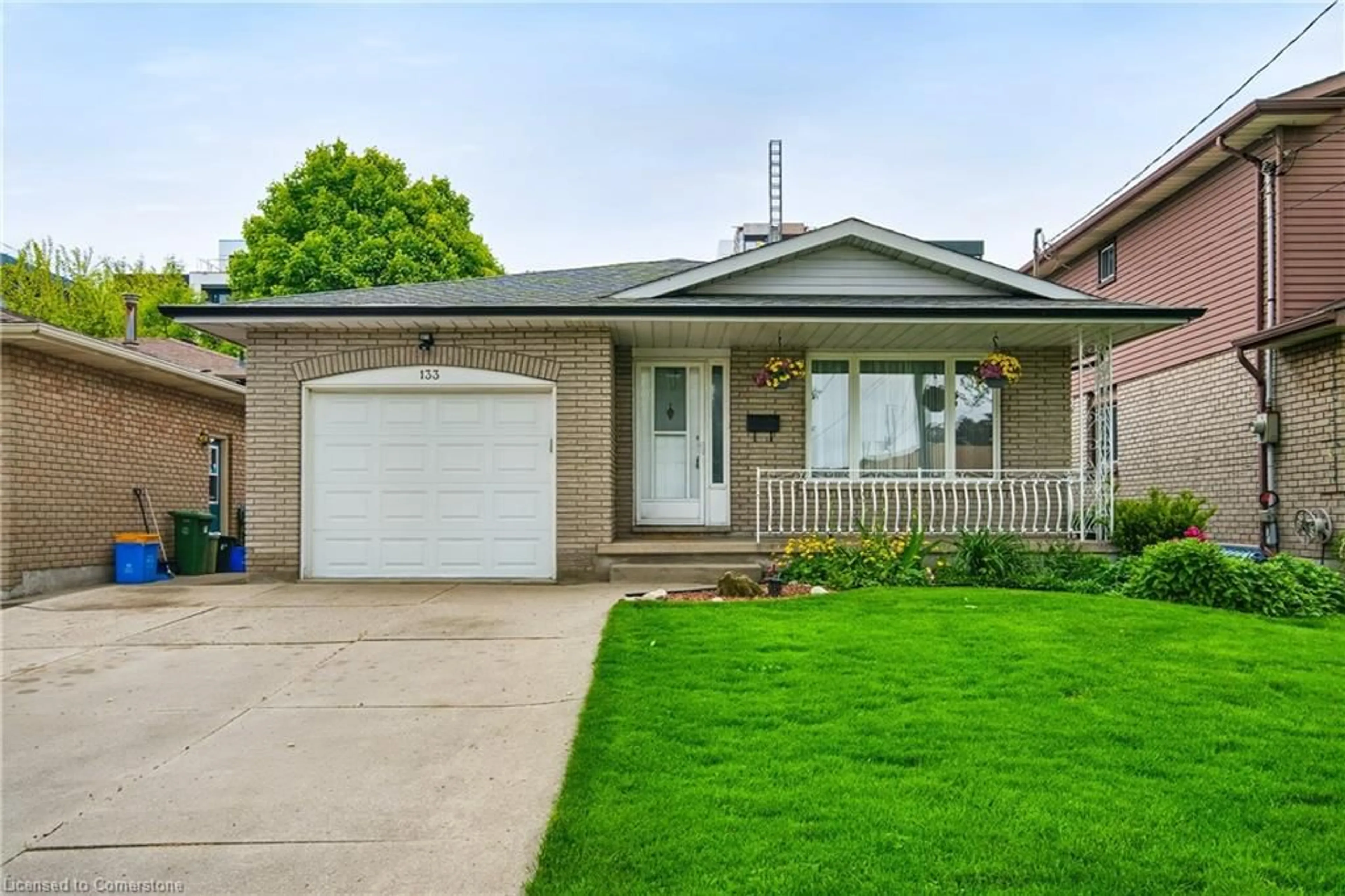 Home with brick exterior material, street for 133 East 8th St, Hamilton Ontario L9A 4Y7