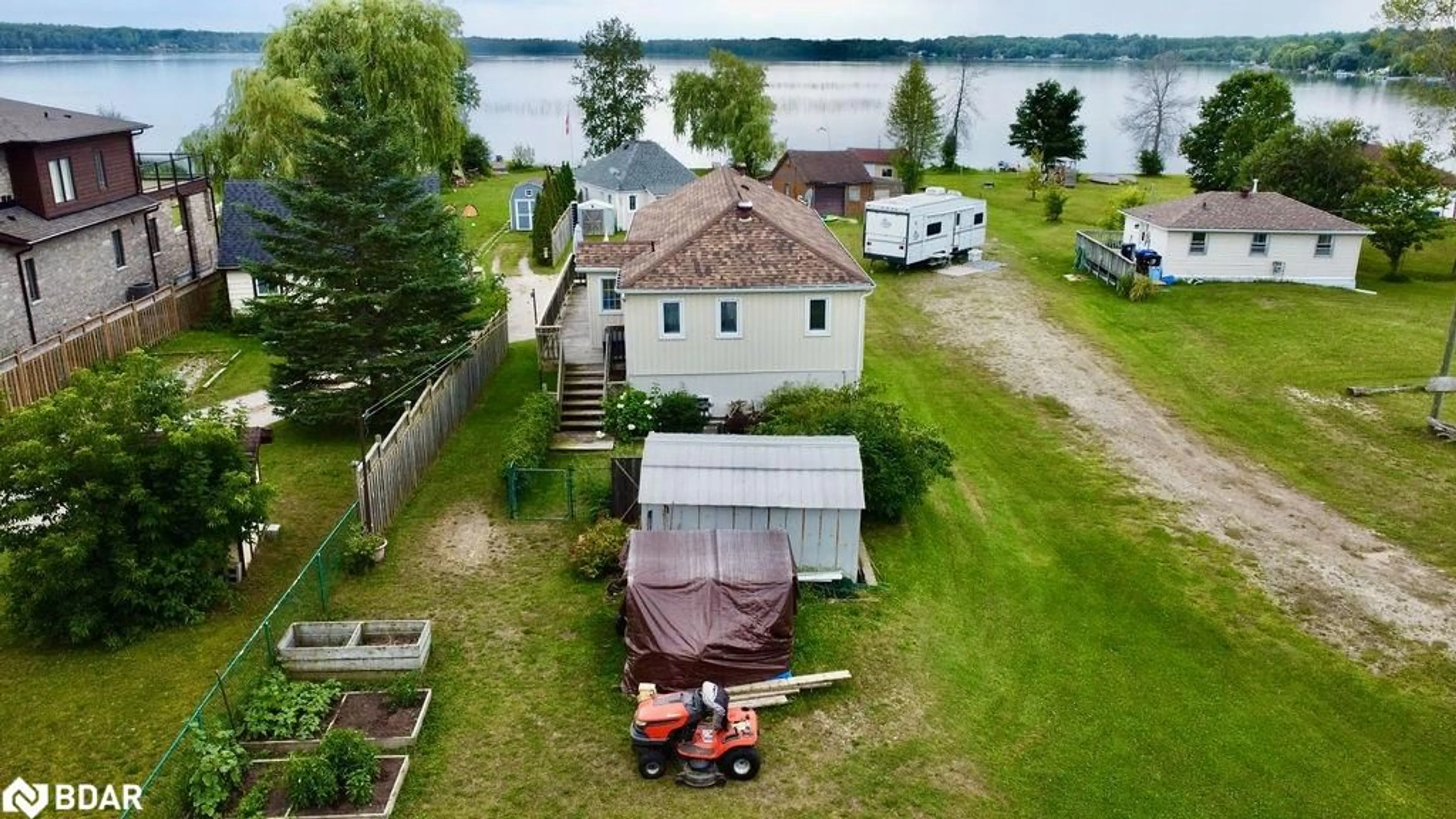 A pic from outside/outdoor area/front of a property/back of a property/a pic from drone, water/lake/river/ocean view for 5632 Penetanguishene Rd, Elmvale Ontario L0L 1P0