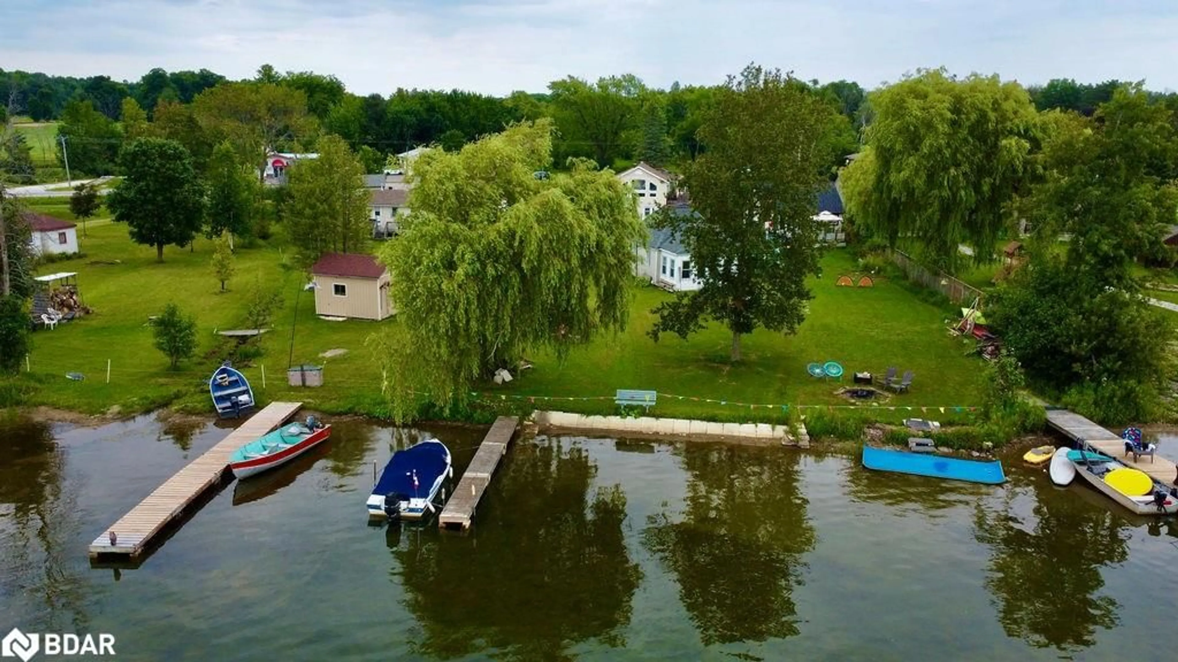 A pic from outside/outdoor area/front of a property/back of a property/a pic from drone, water/lake/river/ocean view for 5632 Penetanguishene Rd, Elmvale Ontario L0L 1P0