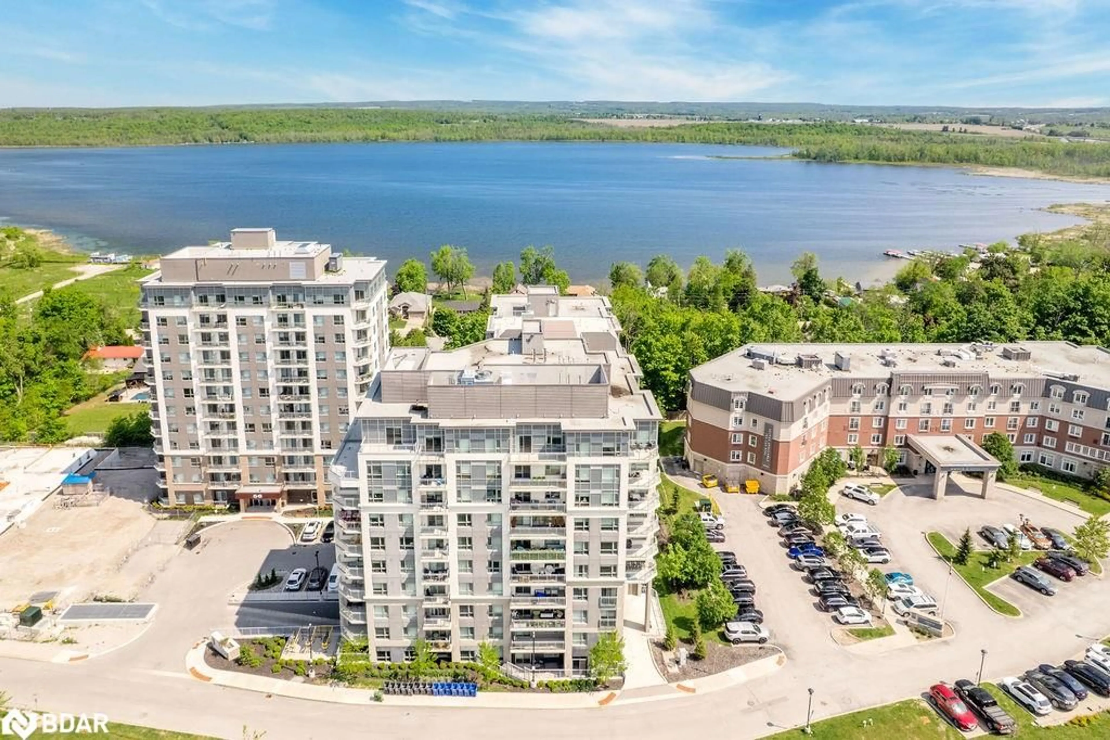 A pic from outside/outdoor area/front of a property/back of a property/a pic from drone, water/lake/river/ocean view for 58 Lakeside Terr #716, Barrie Ontario L4M 0L5