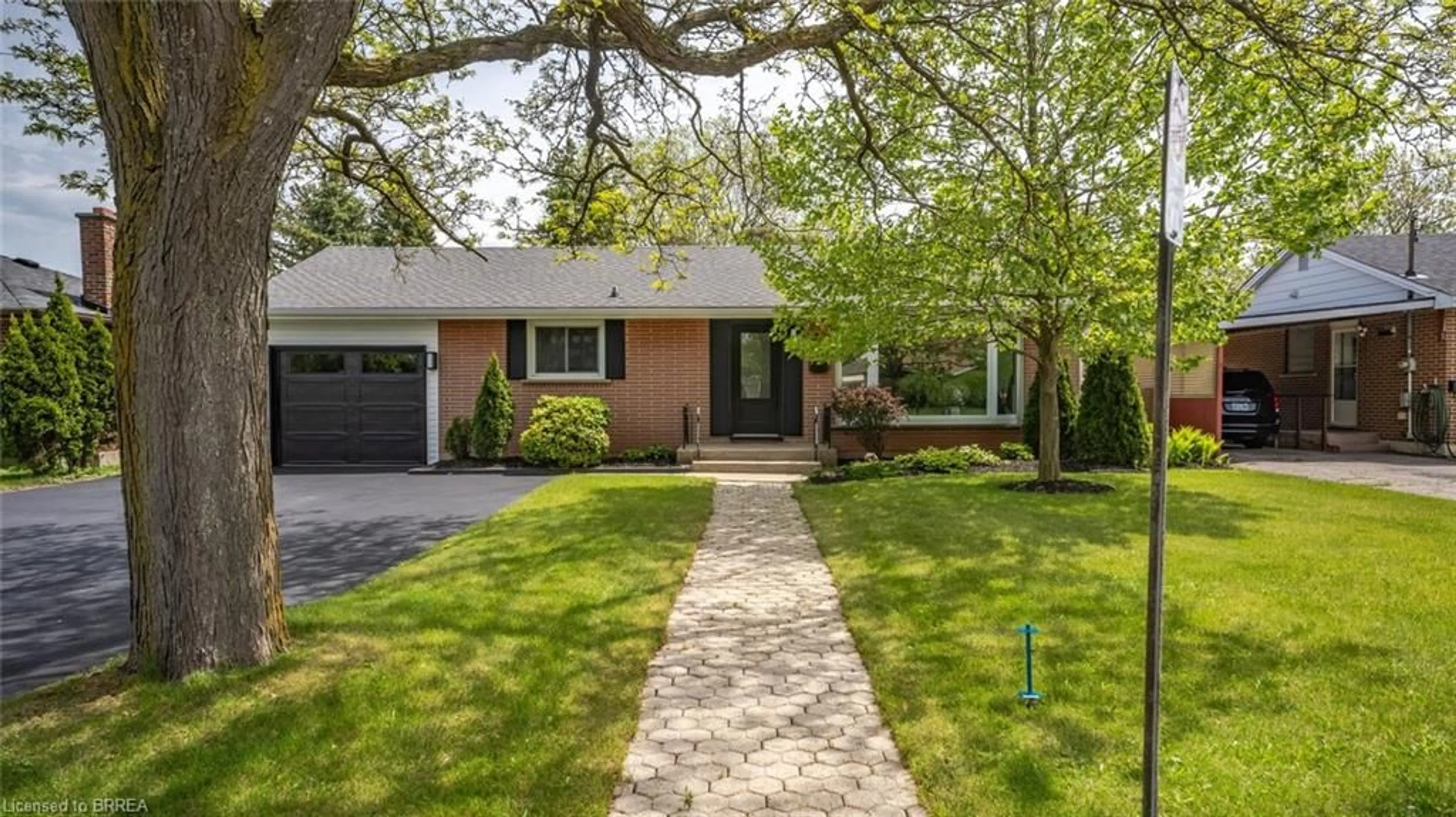 Home with brick exterior material, street for 48 Norman St, Brantford Ontario N3R 2Y2