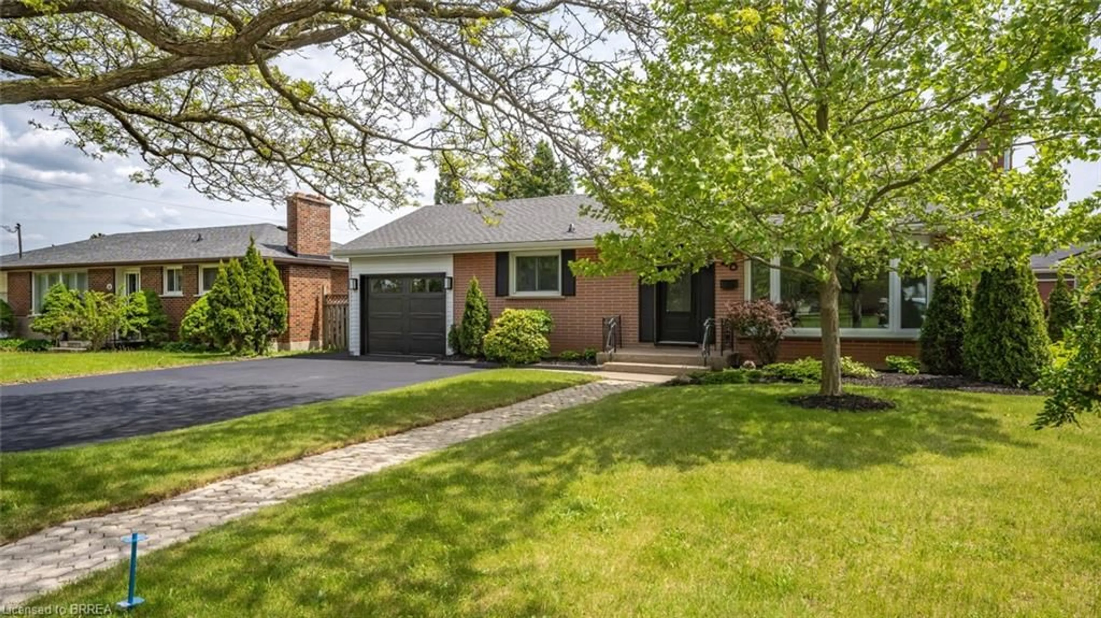 Home with brick exterior material, street for 48 Norman St, Brantford Ontario N3R 2Y2