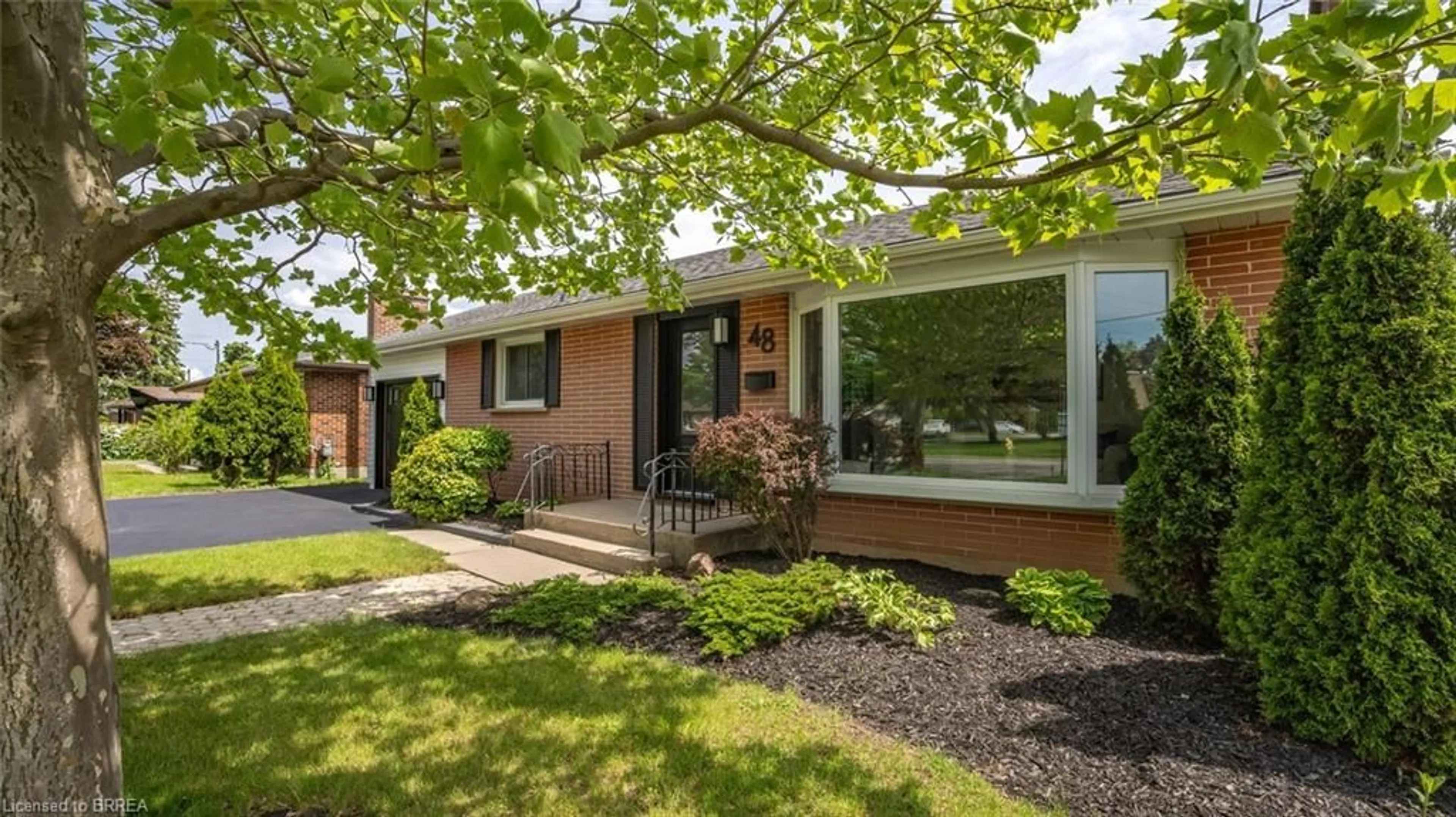 Home with brick exterior material, street for 48 Norman St, Brantford Ontario N3R 2Y2