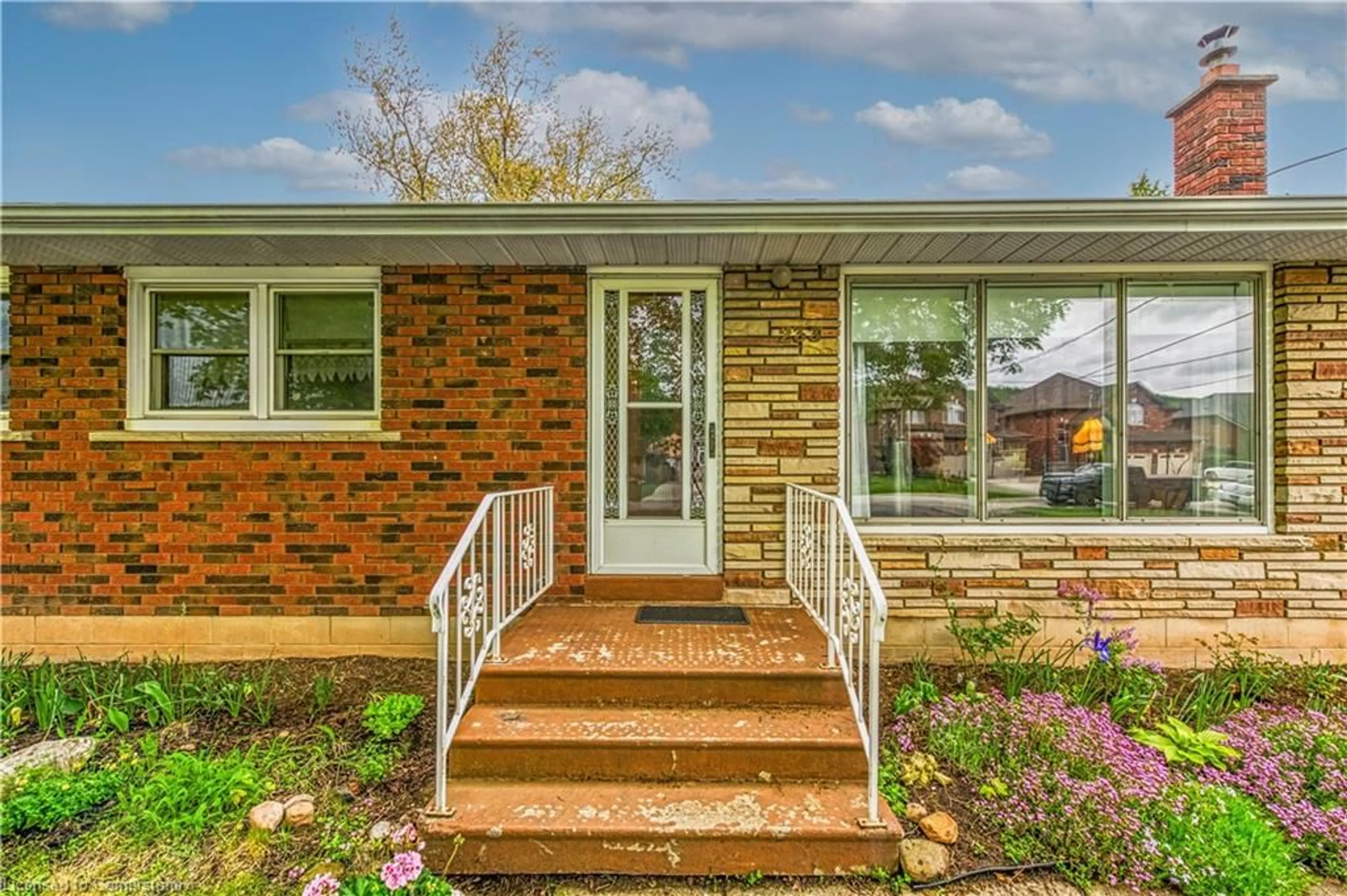 Home with brick exterior material, street for 233 Helena Ave, Hamilton Ontario L8E 5K1