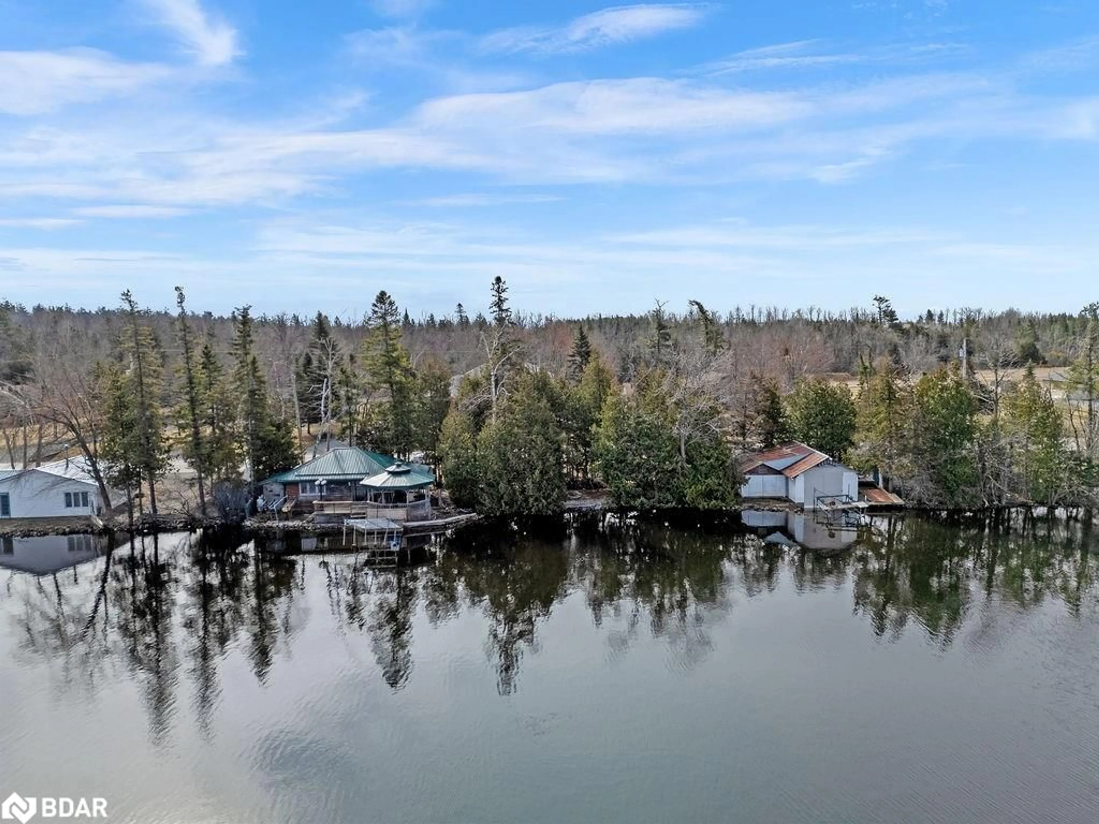 A pic from outside/outdoor area/front of a property/back of a property/a pic from drone, water/lake/river/ocean view for 324 County Road 24, Bobcaygeon Ontario K0M 1A0