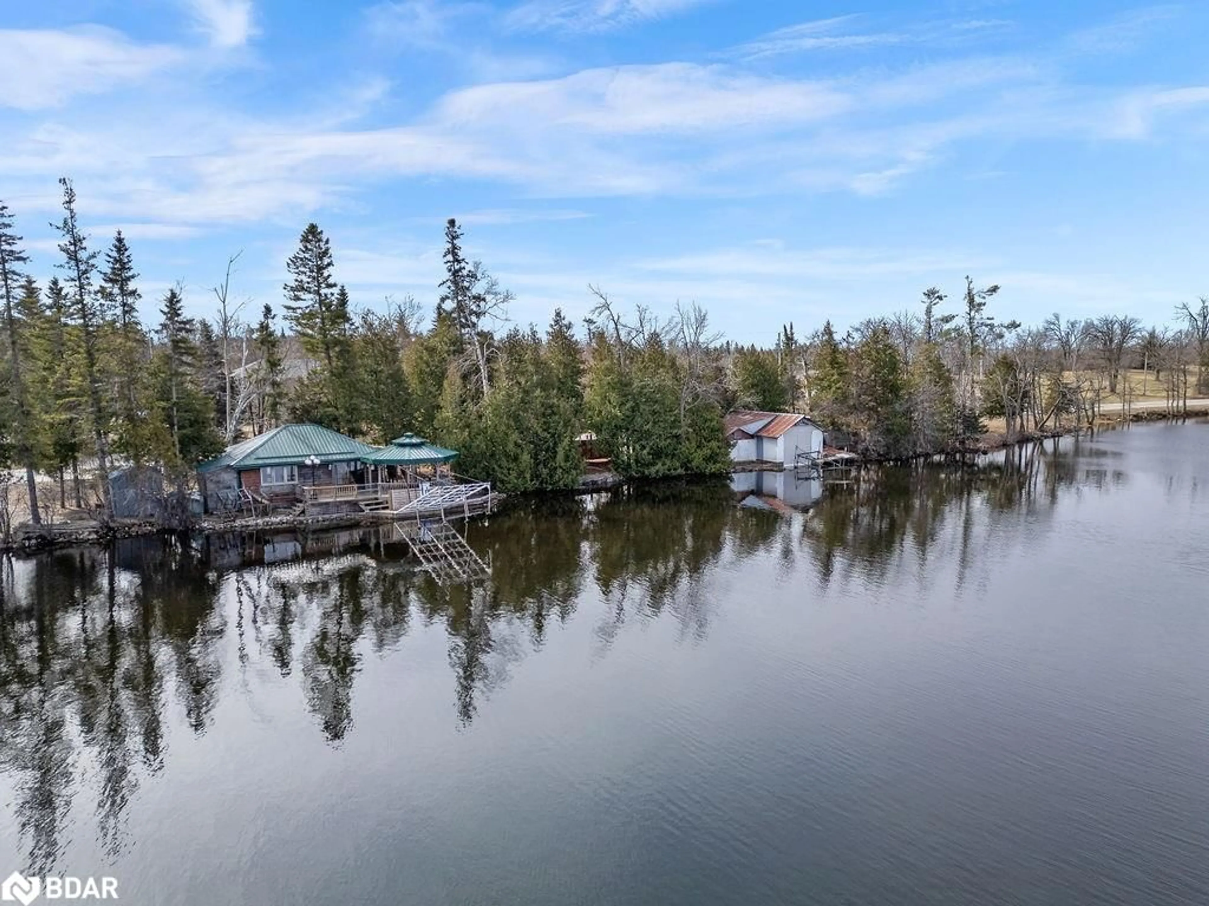 A pic from outside/outdoor area/front of a property/back of a property/a pic from drone, water/lake/river/ocean view for 324 County Road 24, Bobcaygeon Ontario K0M 1A0