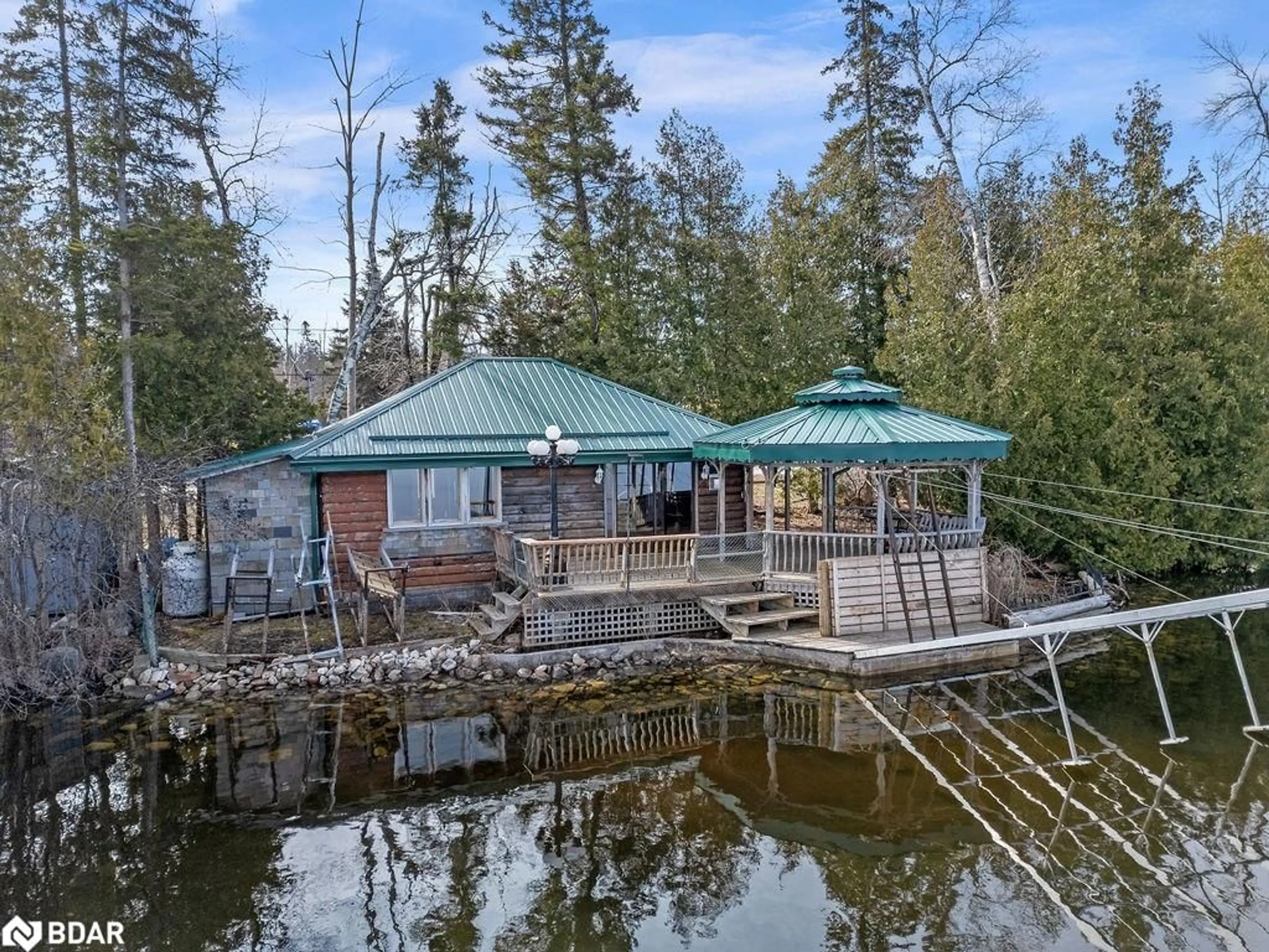 A pic from outside/outdoor area/front of a property/back of a property/a pic from drone, water/lake/river/ocean view for 324 County Road 24, Bobcaygeon Ontario K0M 1A0