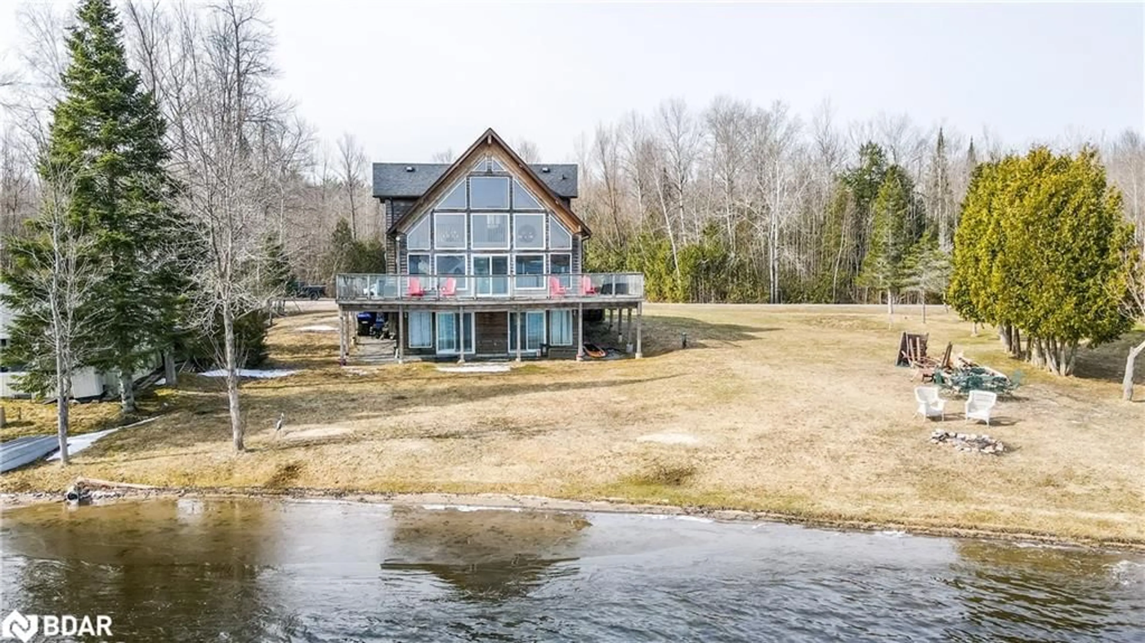 A pic from outside/outdoor area/front of a property/back of a property/a pic from drone, water/lake/river/ocean view for 3093 Sandy Bend Rd, Elmvale Ontario L0L 1P0