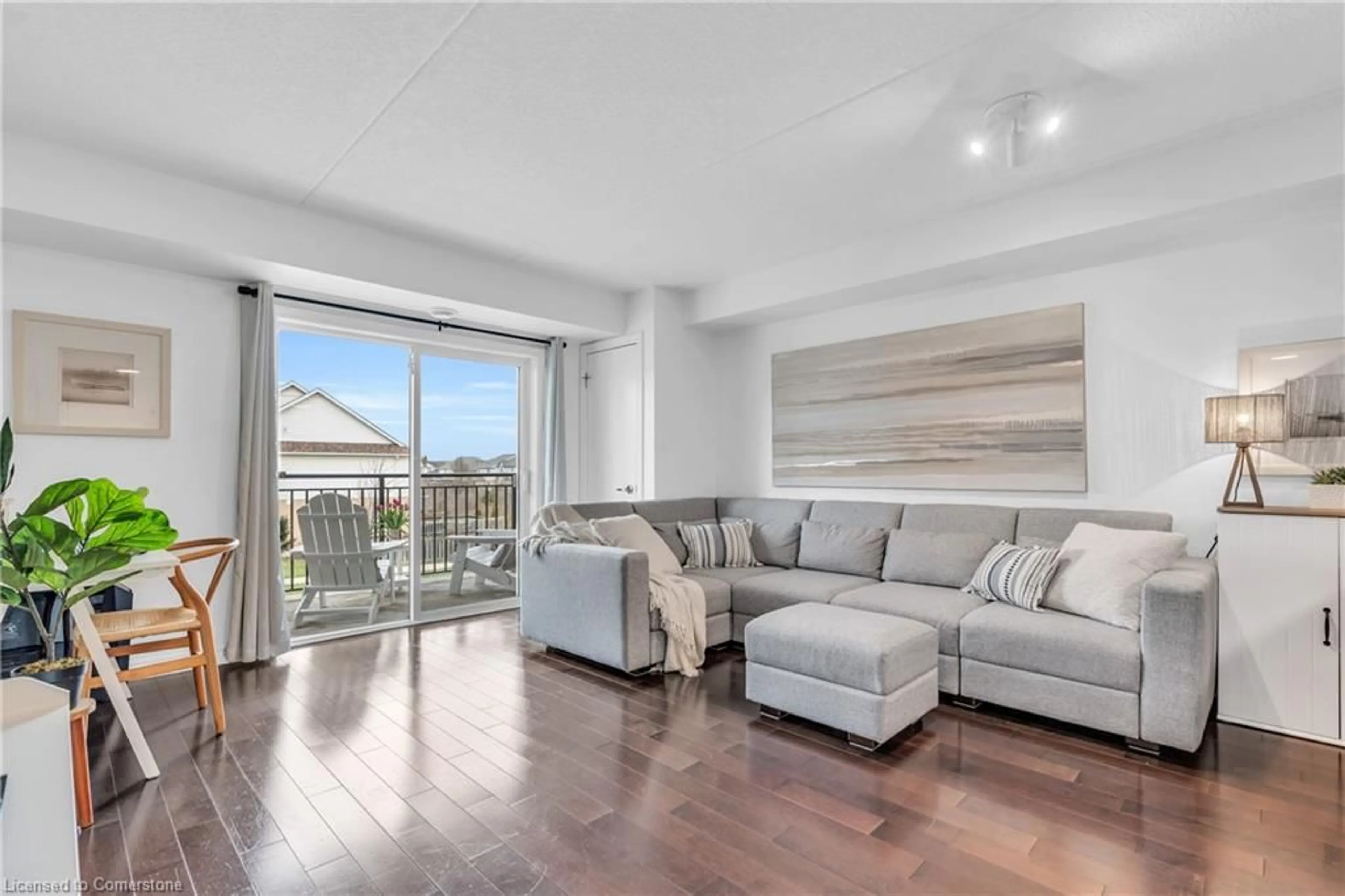 Living room with furniture, wood/laminate floor for 39 Goodwin Dr #205, Guelph Ontario N1L 0E5