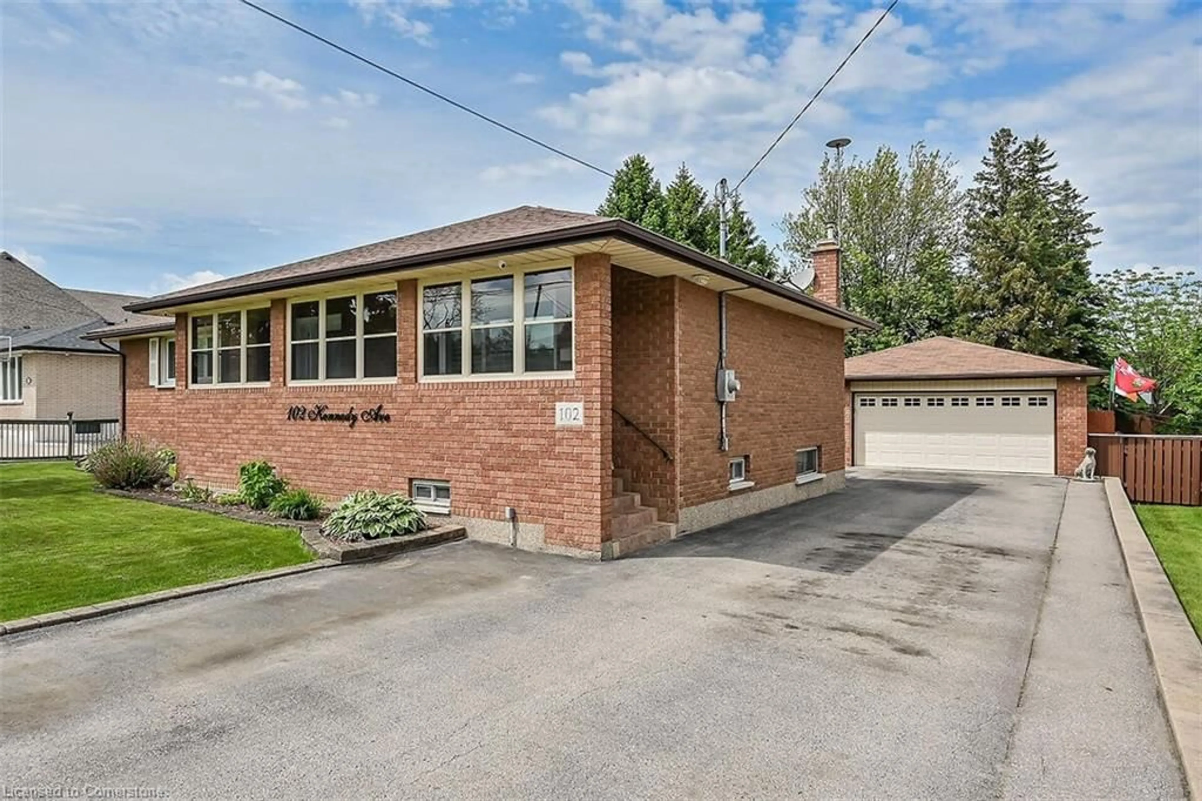 Home with brick exterior material, street for 102 Kennedy Ave, Hamilton Ontario L9B 1C7