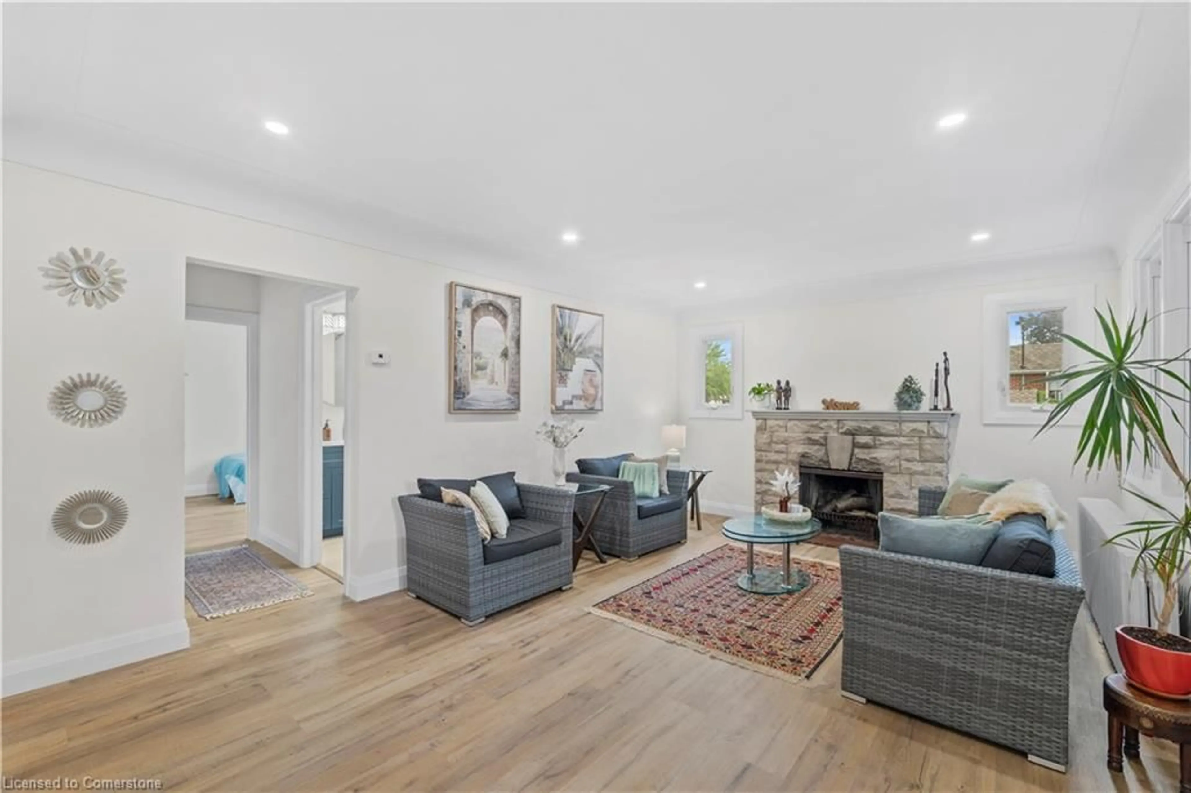 Living room with furniture, wood/laminate floor for 87A Barons Ave, Hamilton Ontario L8K 2Y4