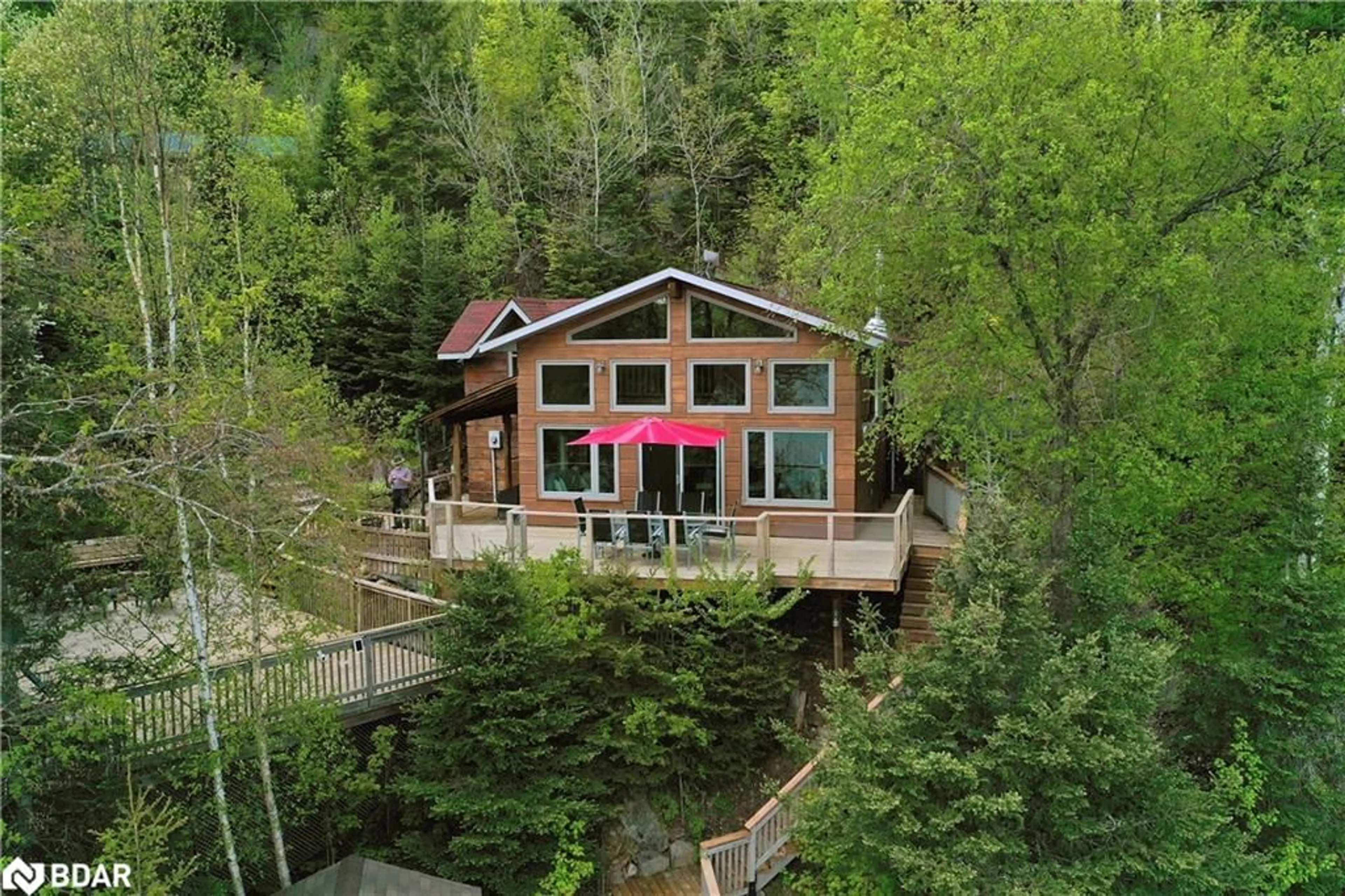 A pic from outside/outdoor area/front of a property/back of a property/a pic from drone, water/lake/river/ocean view for 63 Rouff Road, Trout Creek Ontario P0H 2L0