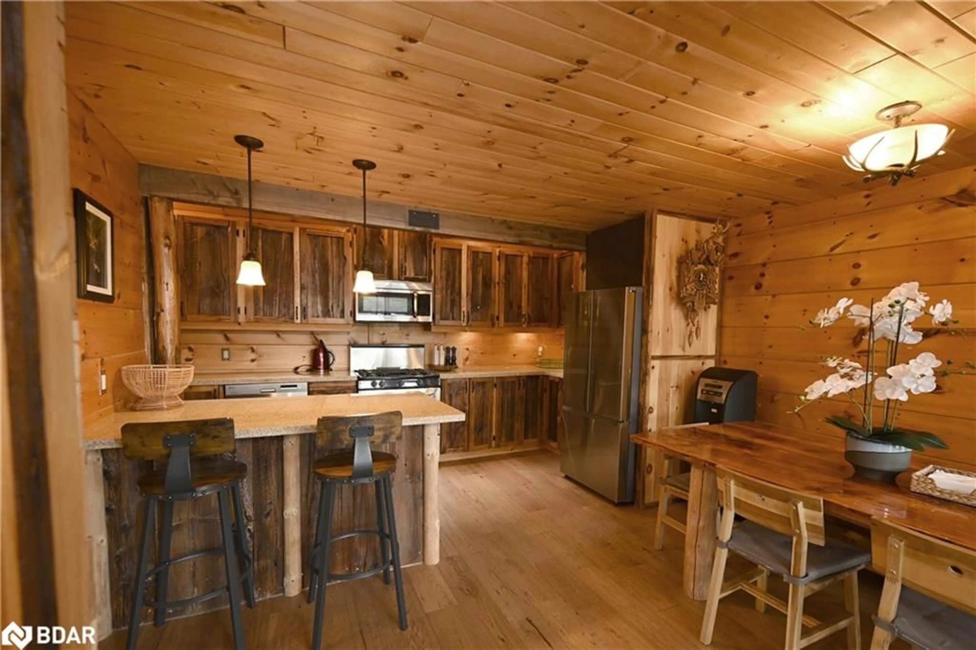 Rustic kitchen, wood/laminate floor for 63 Rouff Road, Trout Creek Ontario P0H 2L0