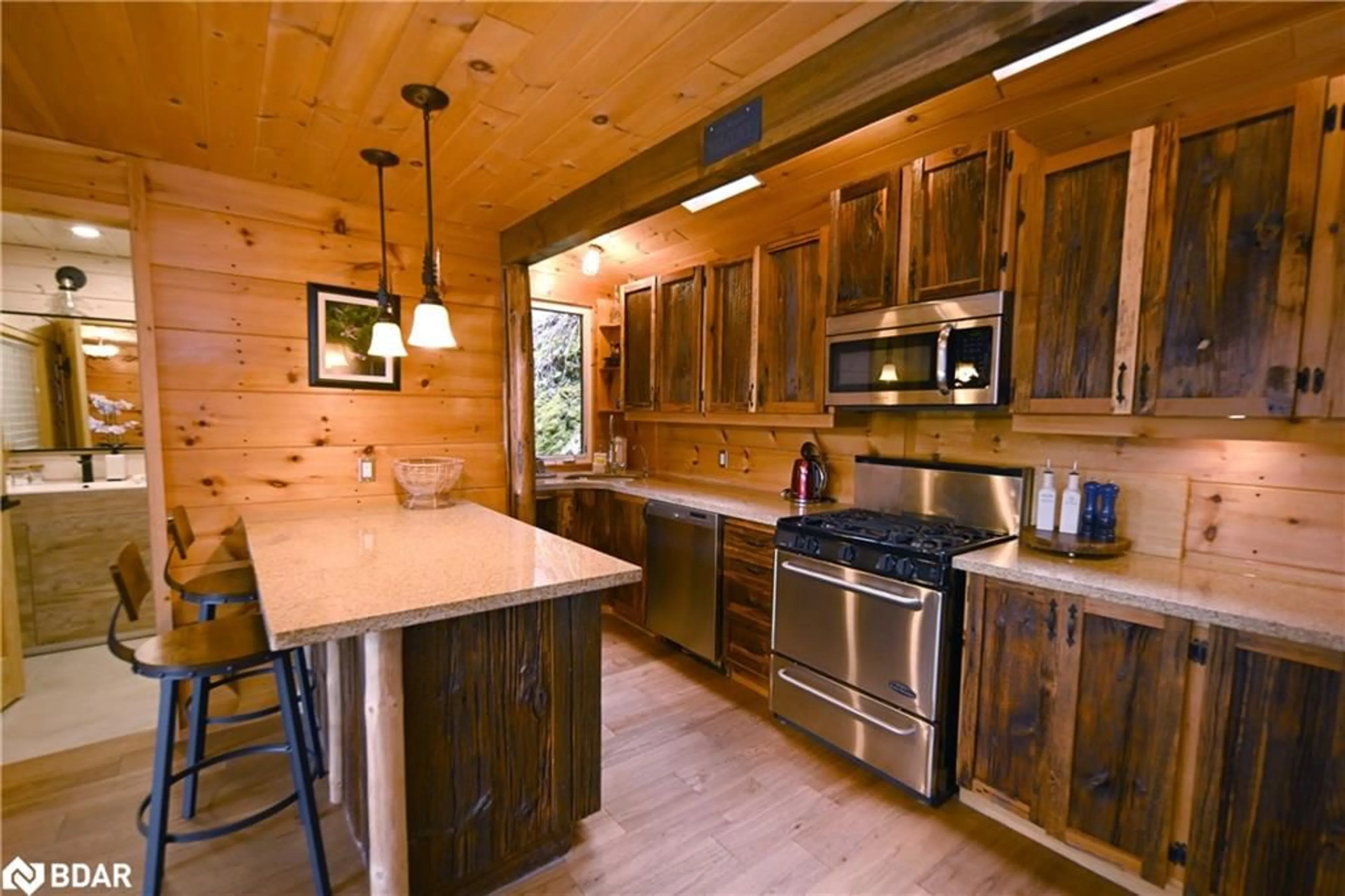 Rustic kitchen, wood/laminate floor for 63 Rouff Road, Trout Creek Ontario P0H 2L0