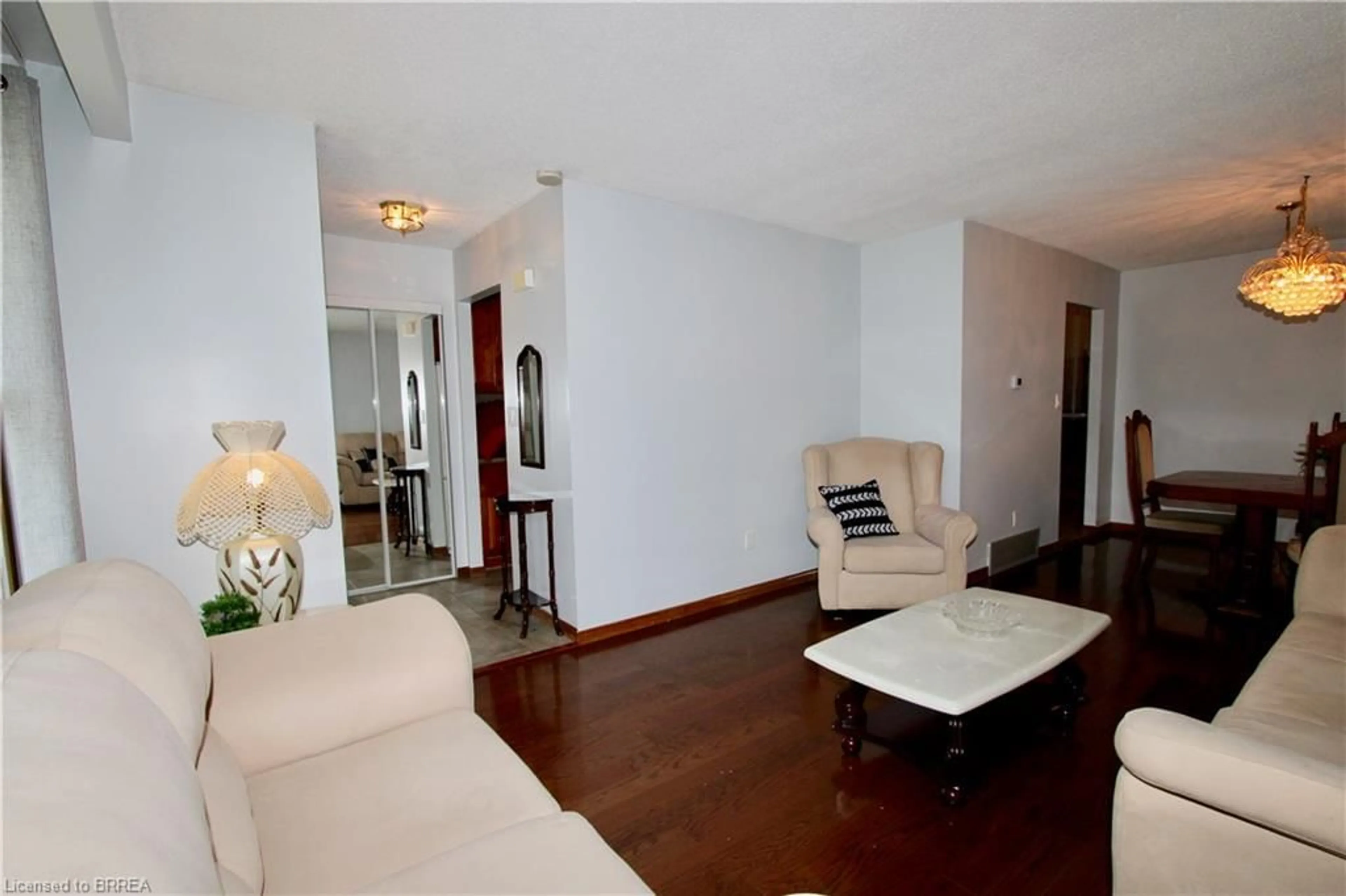 Living room with furniture, wood/laminate floor for 759 Upper Horning Rd, Hamilton Ontario L9C 7P7