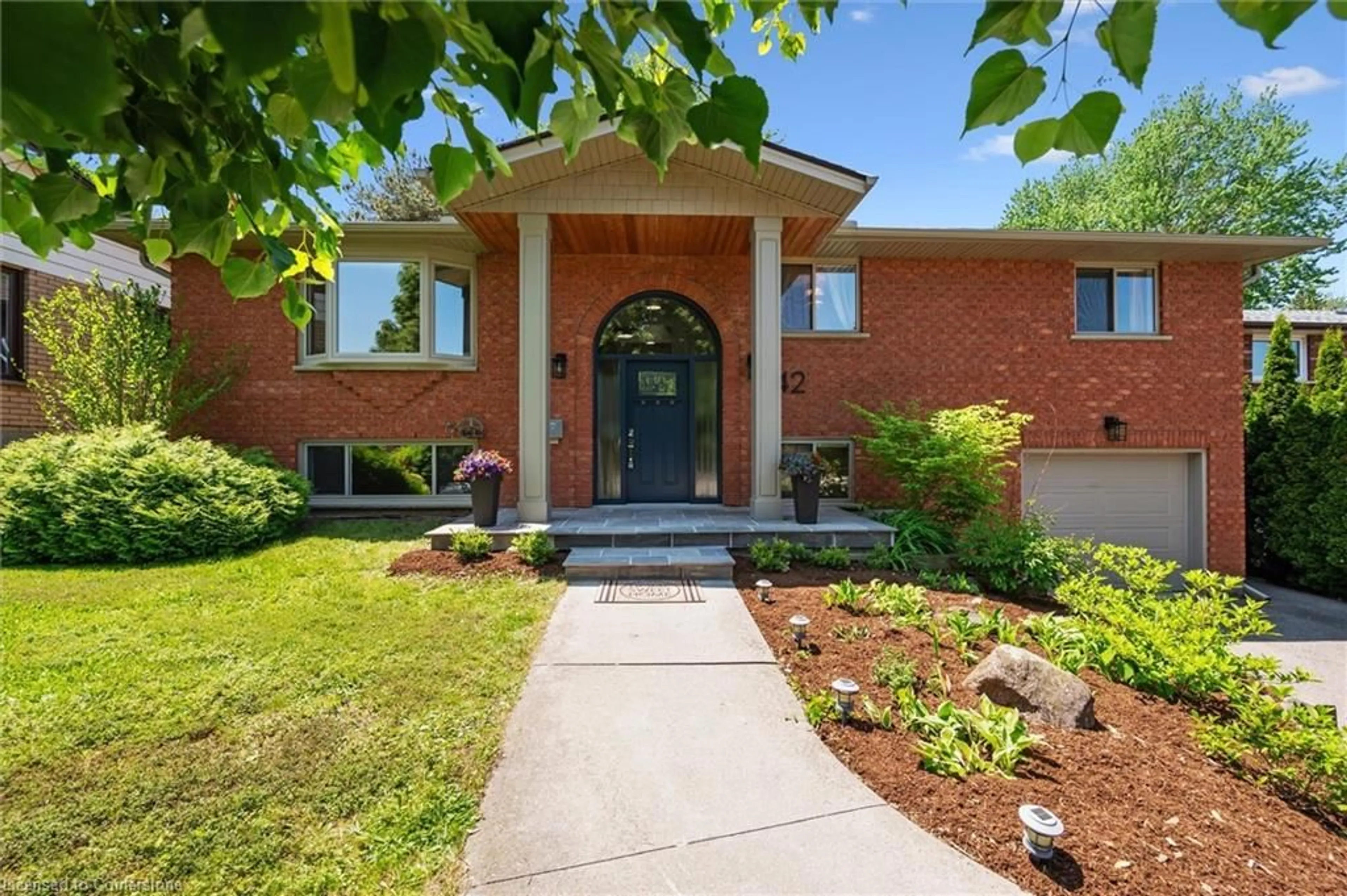 Home with brick exterior material, street for 42 Leslie Ave, Cambridge Ontario N1S 4N7