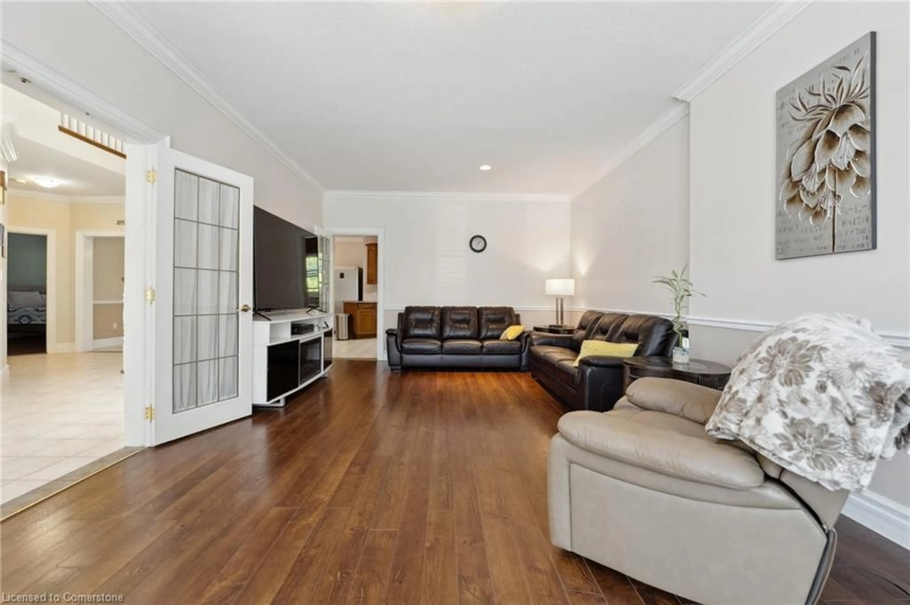 Living room with furniture, wood/laminate floor for 1673 St Paul St, St. Catharines Ontario L2R 6P7