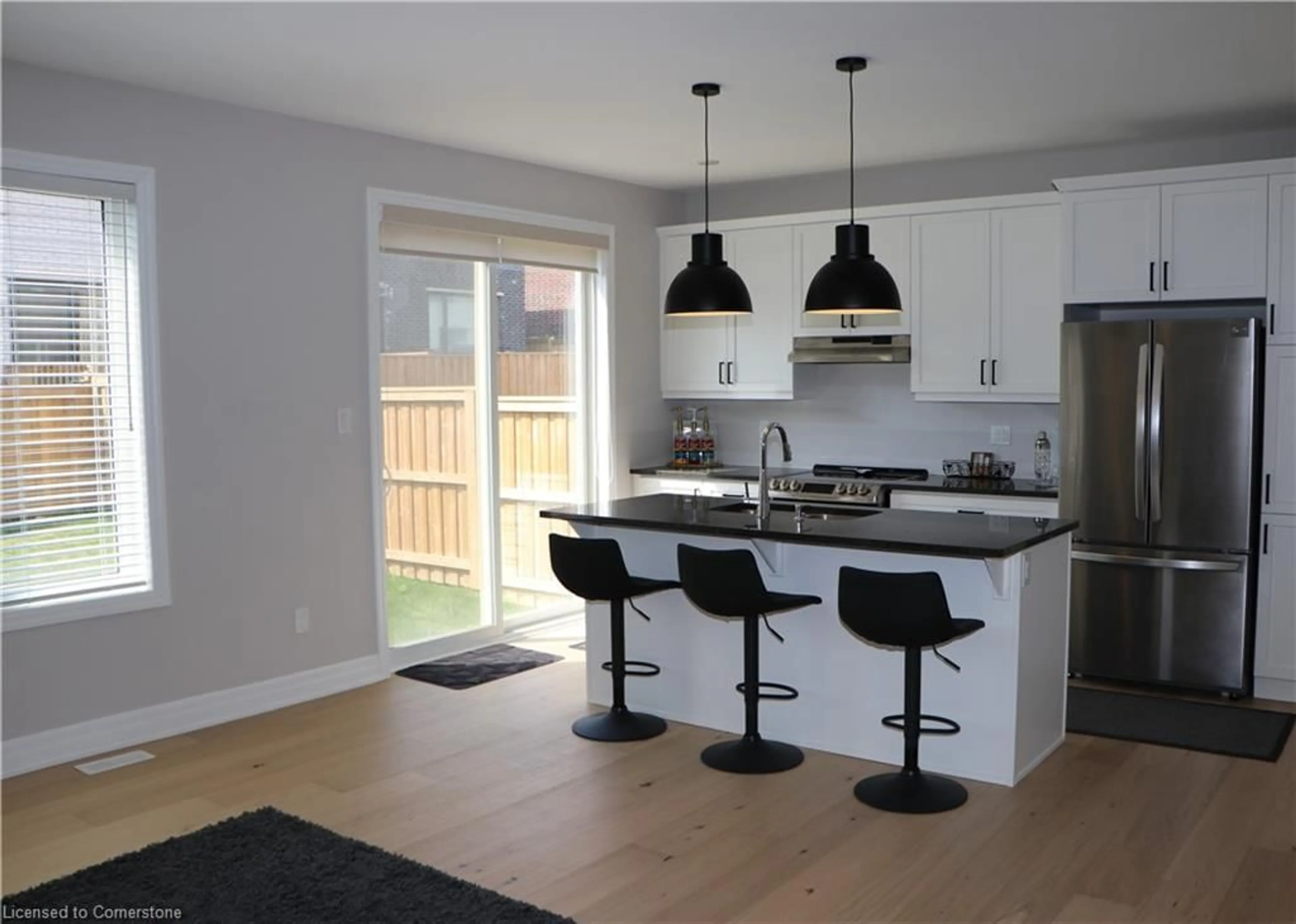 Open concept kitchen, wood/laminate floor for 58 William Nador St, Kitchener Ontario N2R 0S3