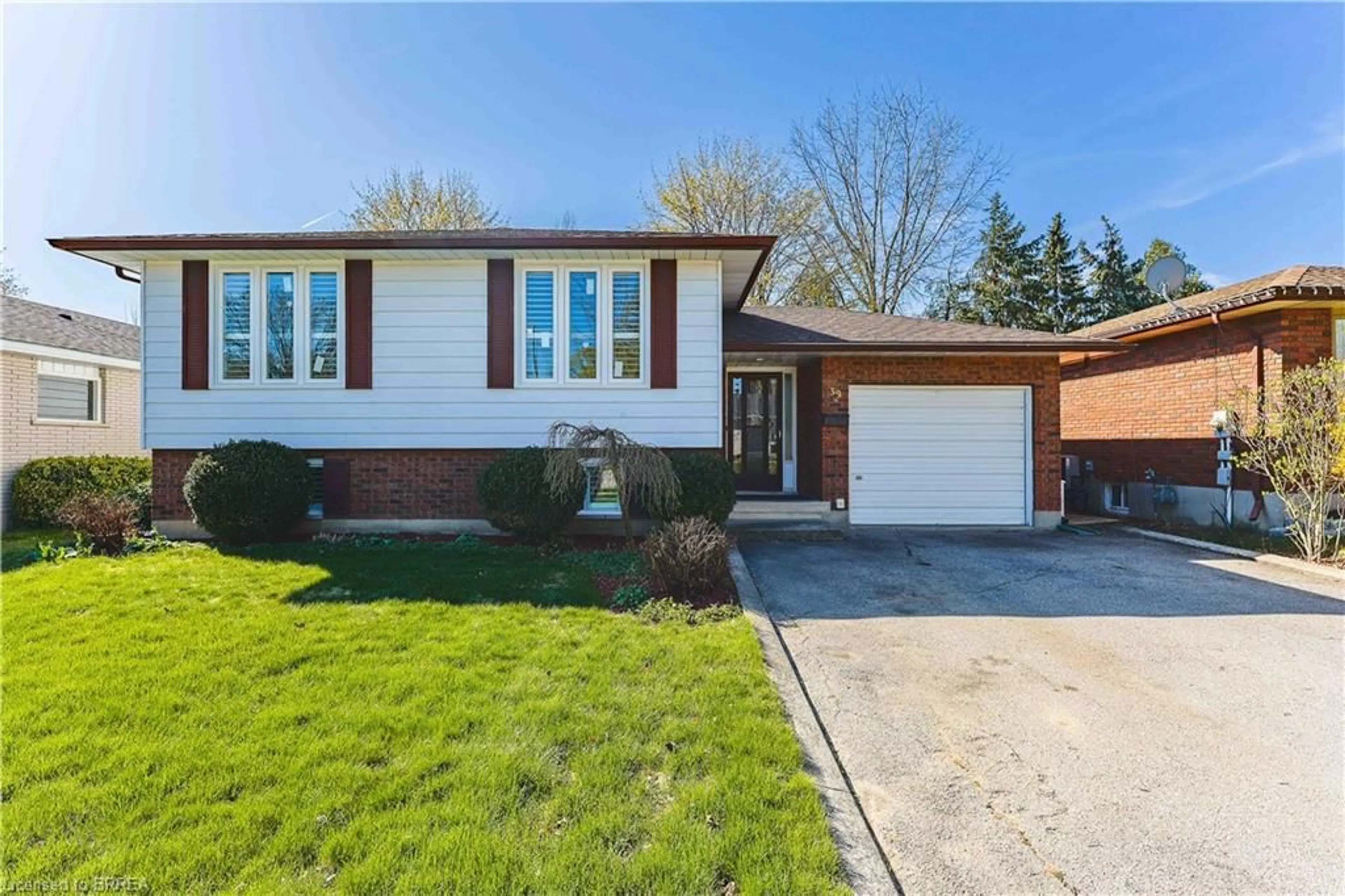 Home with brick exterior material, street for 39 Wildflower Lane, Brantford Ontario N3R 6B3