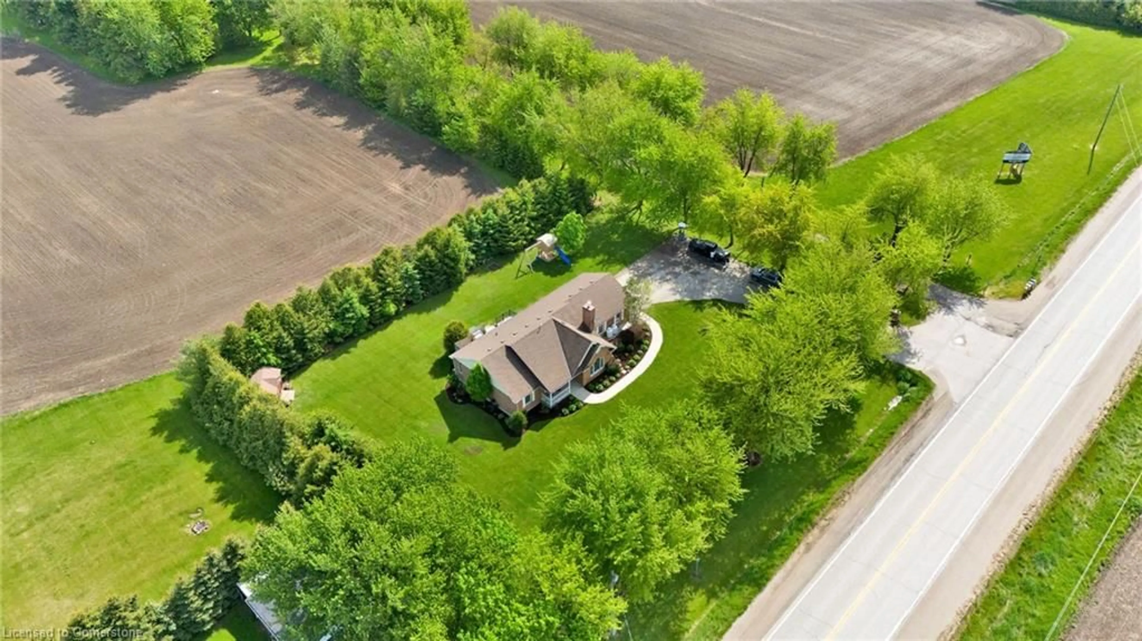 A pic from outside/outdoor area/front of a property/back of a property/a pic from drone, street for 7635 Wellington Road 7, Alma Ontario N0B 1A0