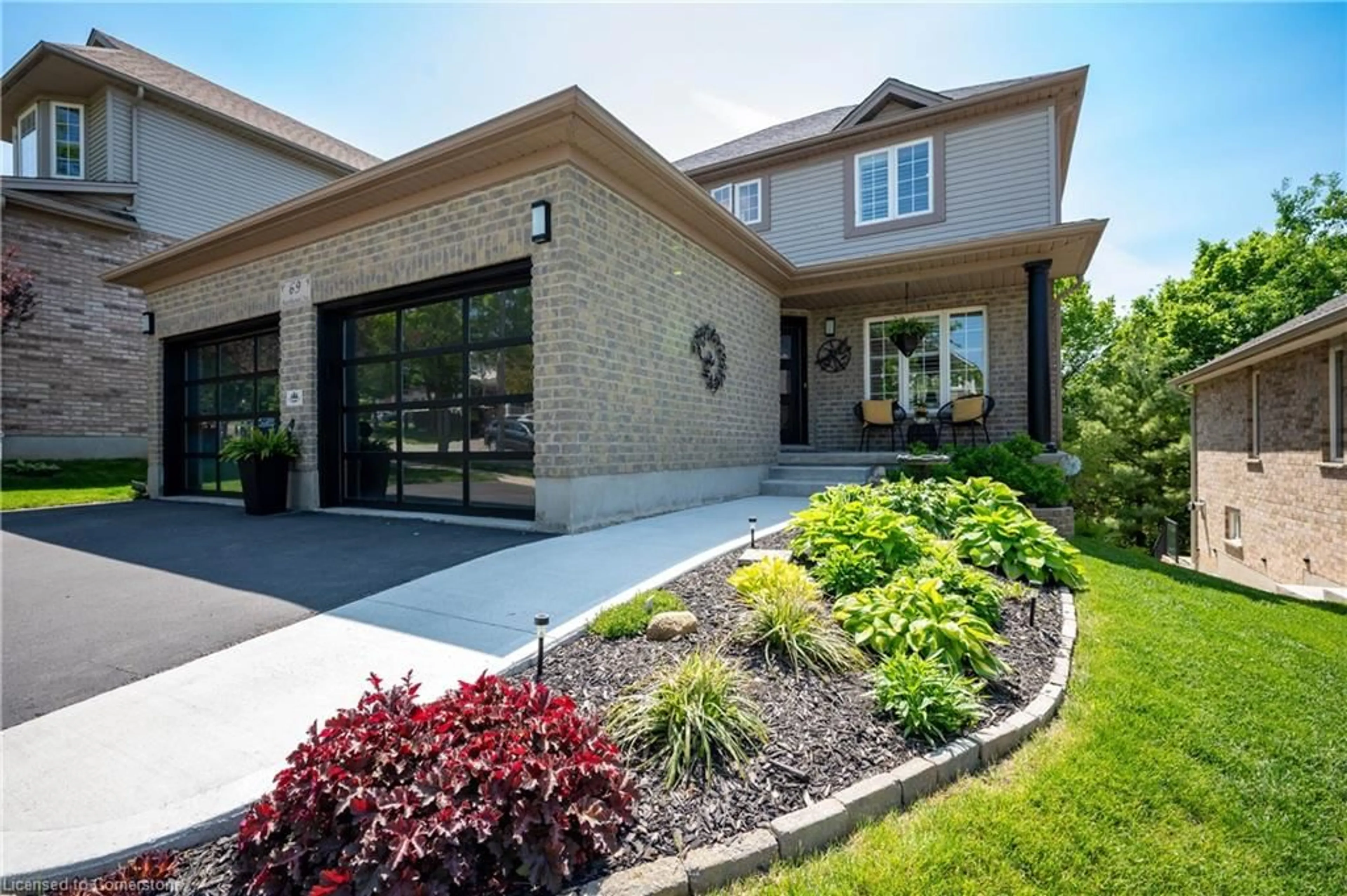 Home with brick exterior material, street for 69 Hearthwood Cres, Kitchener Ontario N2R 1K6