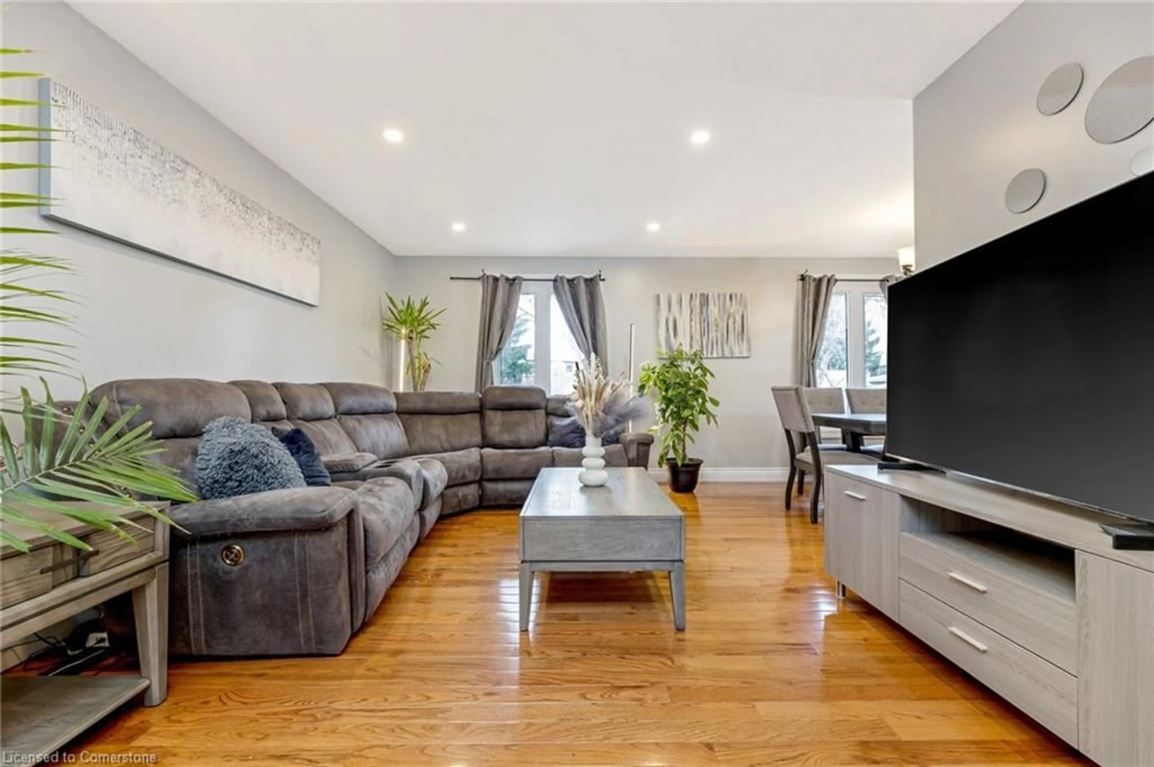 Living room with furniture, wood/laminate floor for 35 Forestgate Dr, Hamilton Ontario L9C 6A4