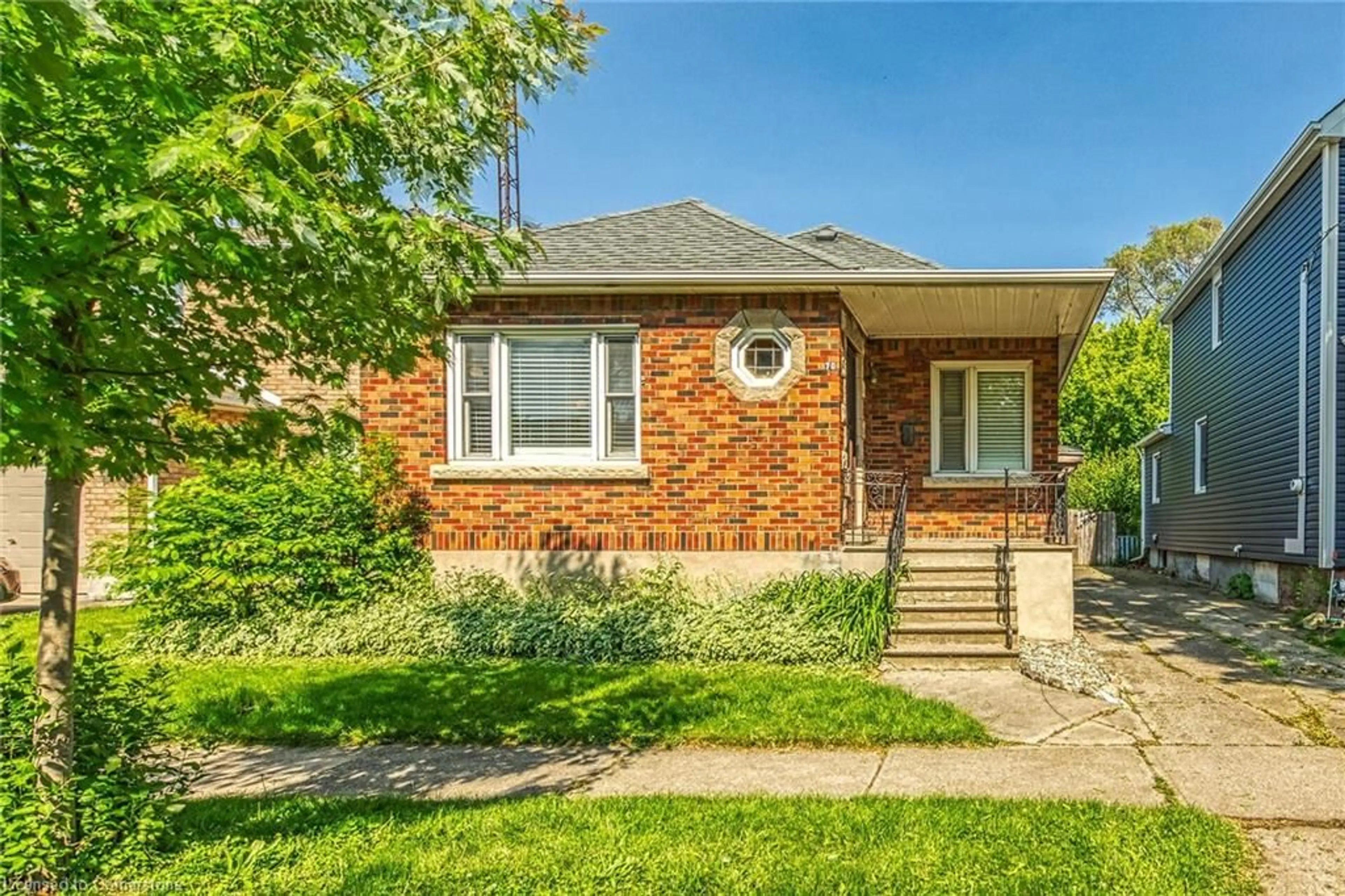 Home with brick exterior material, street for 70 Concord Avenue Ave, St. Catharines Ontario L2M 5N8