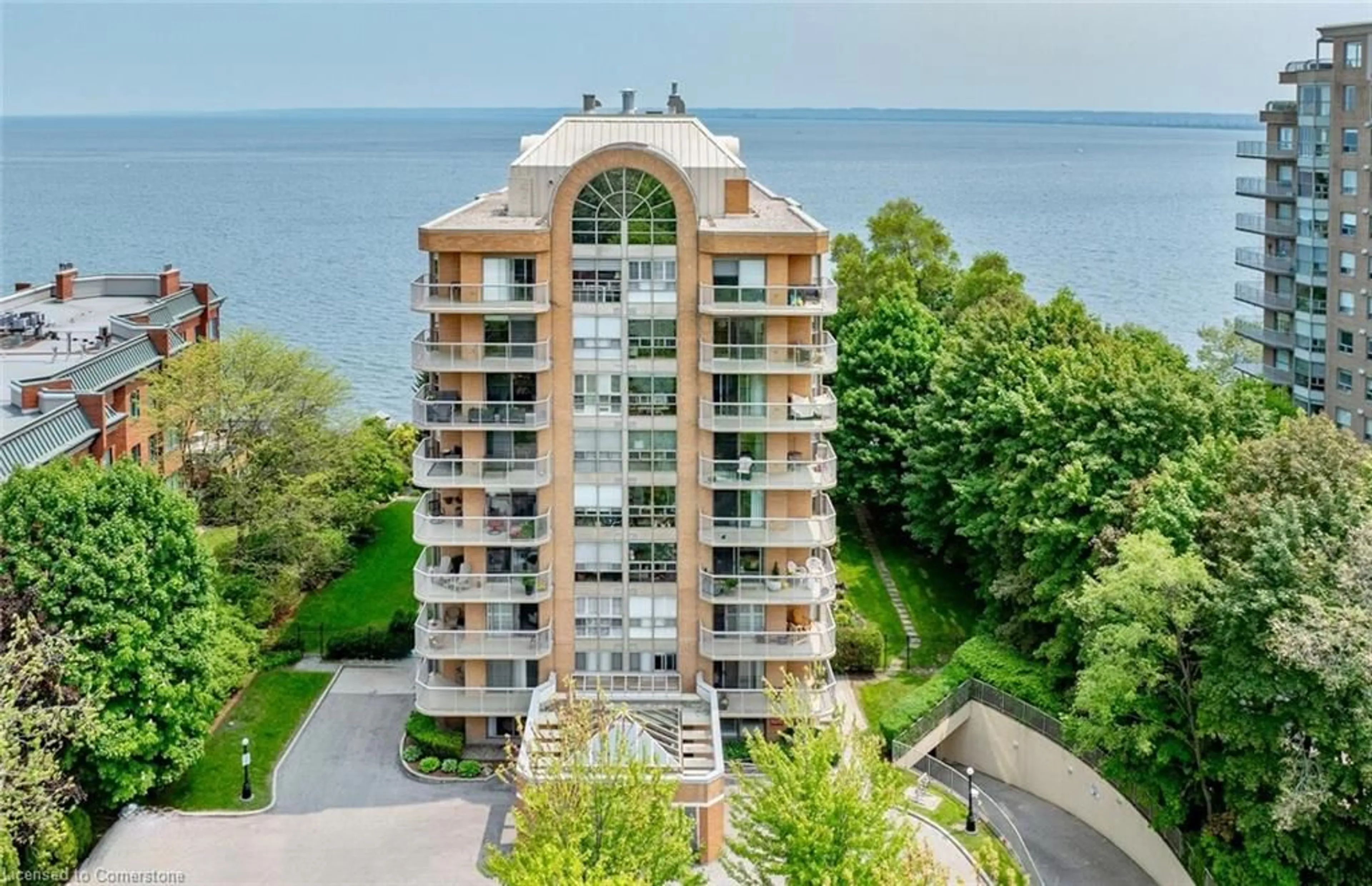 A pic from outside/outdoor area/front of a property/back of a property/a pic from drone, water/lake/river/ocean view for 2210 Lakeshore Rd #803, Burlington Ontario L7R 4J9