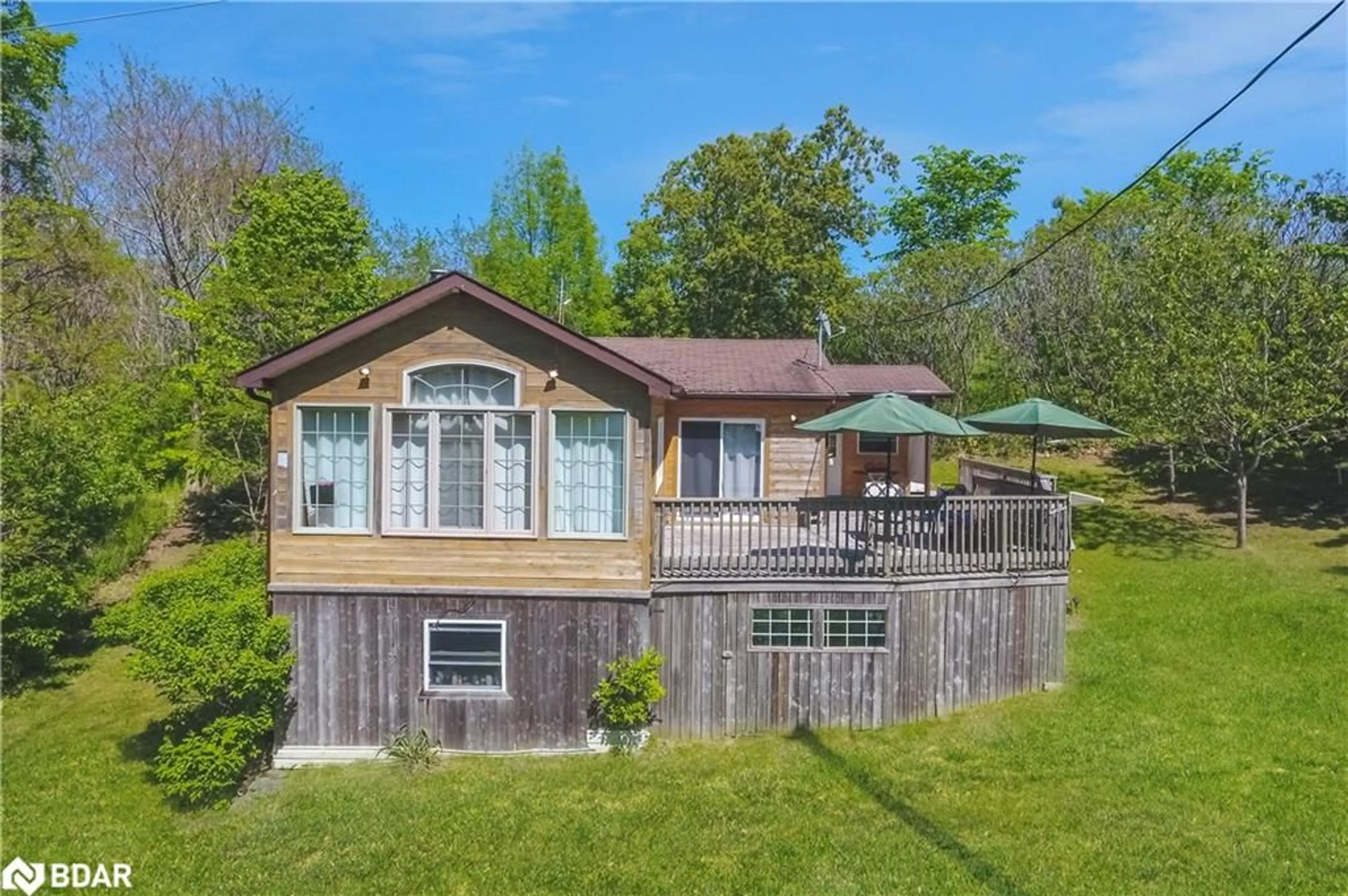 A pic from outside/outdoor area/front of a property/back of a property/a pic from drone, water/lake/river/ocean view for 50 Long Island, Bailieboro Ontario K0L 1B0
