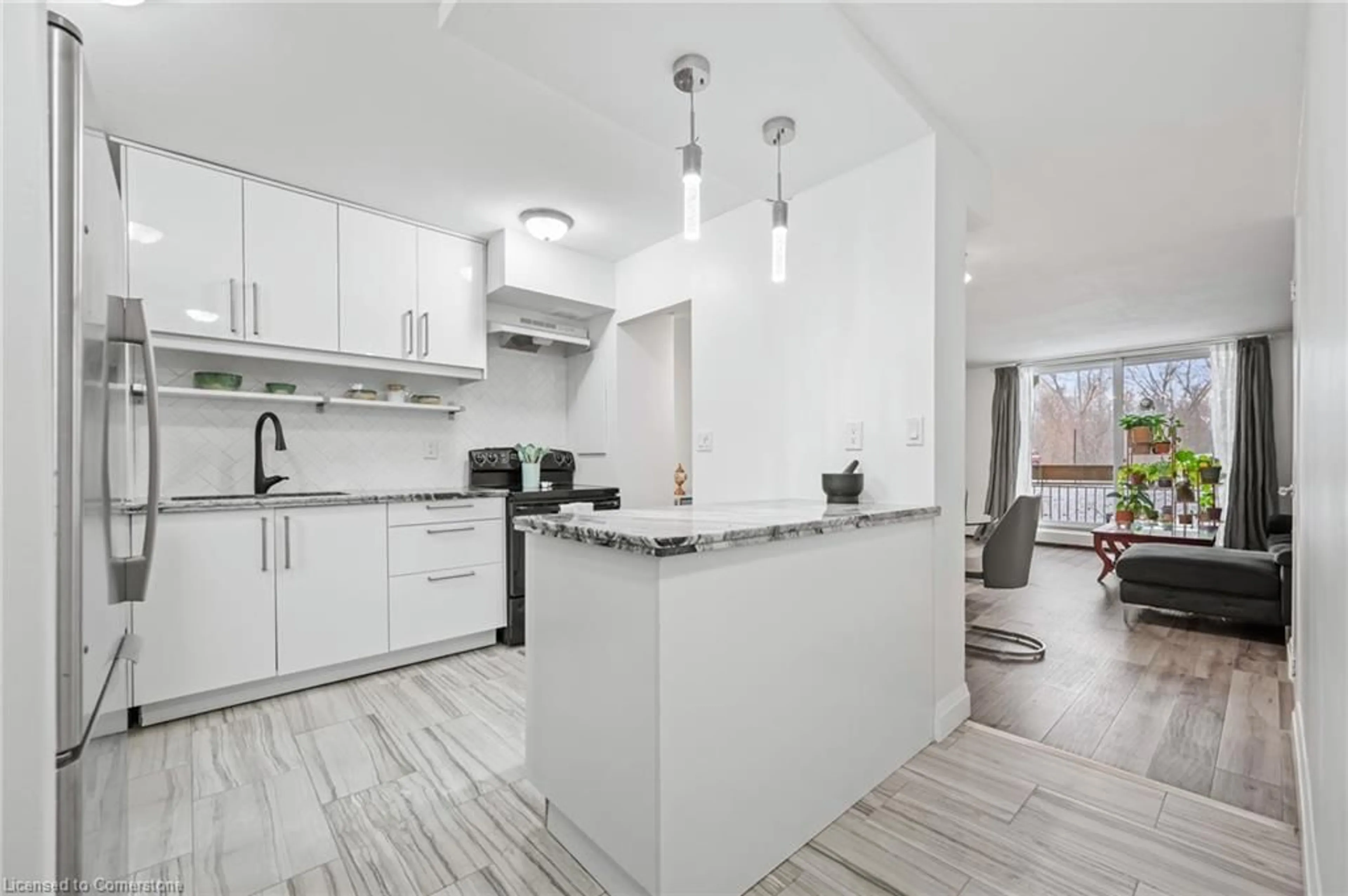 Open concept kitchen, ceramic/tile floor for 350 Quigley Rd #141, Hamilton Ontario L8K 5N2