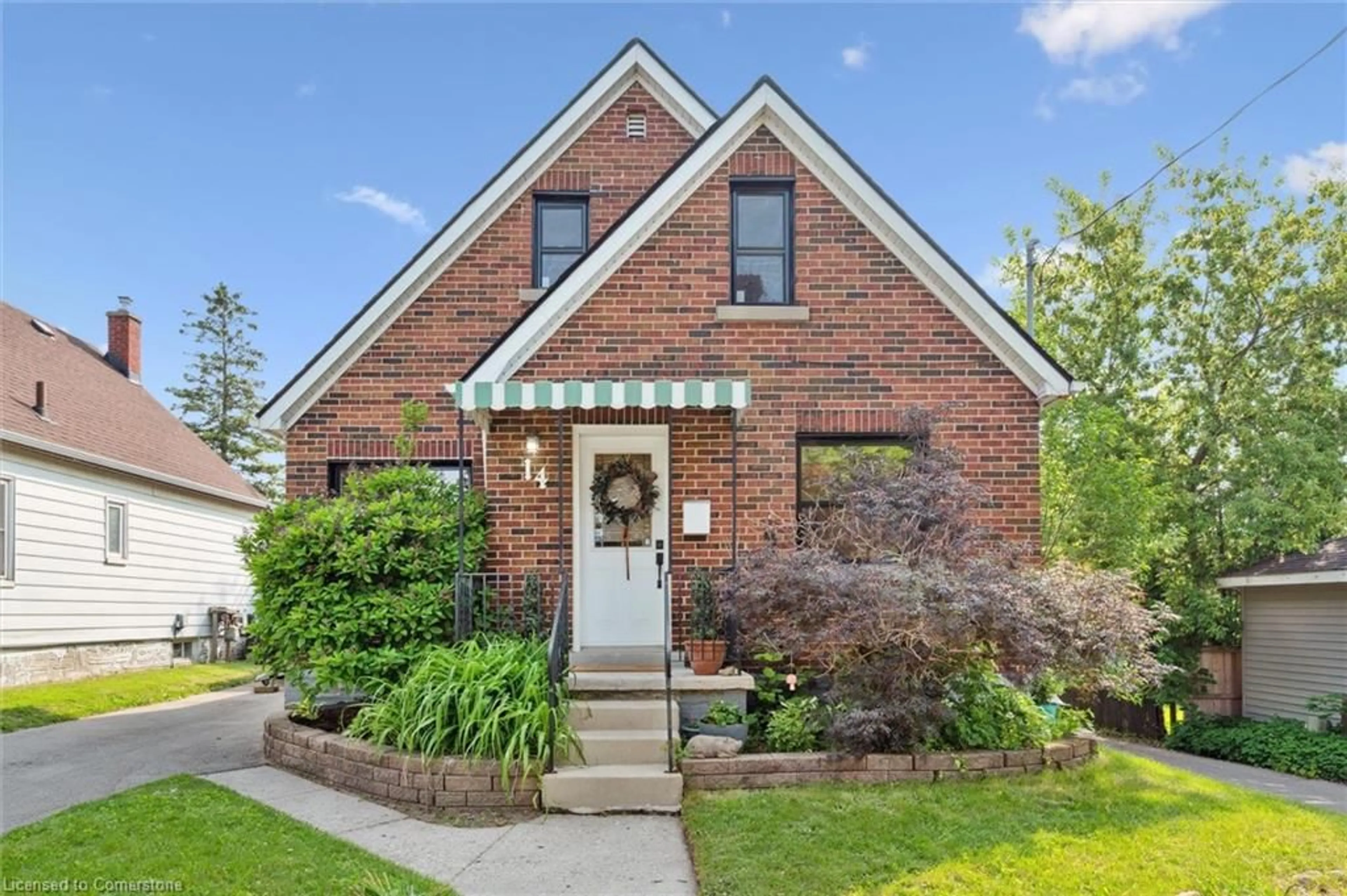 Home with brick exterior material, street for 14 Edwin St, Kitchener Ontario N2H 4N8
