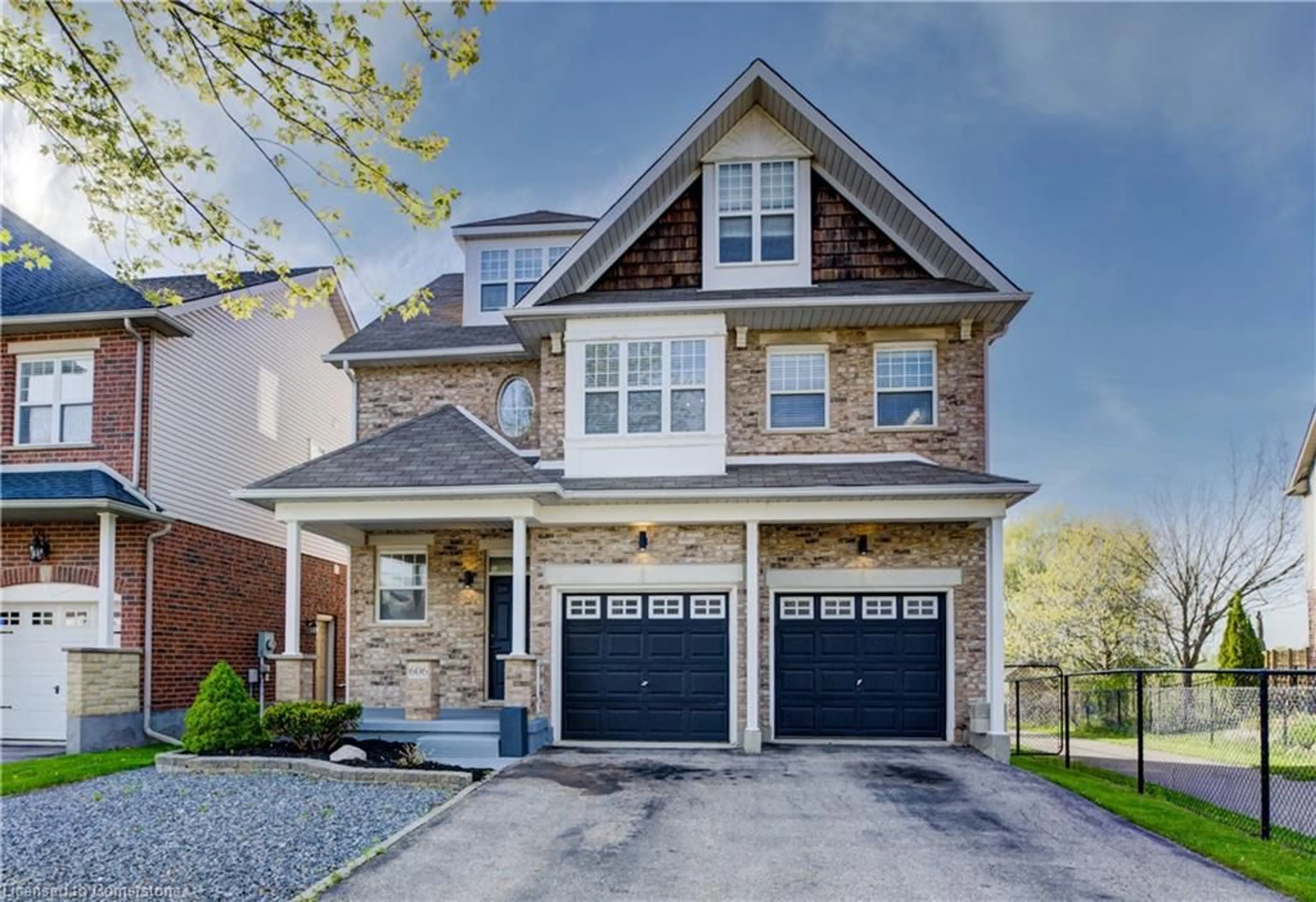 Home with brick exterior material, street for 606 Frieburg Dr, Waterloo Ontario N2T 2Y4