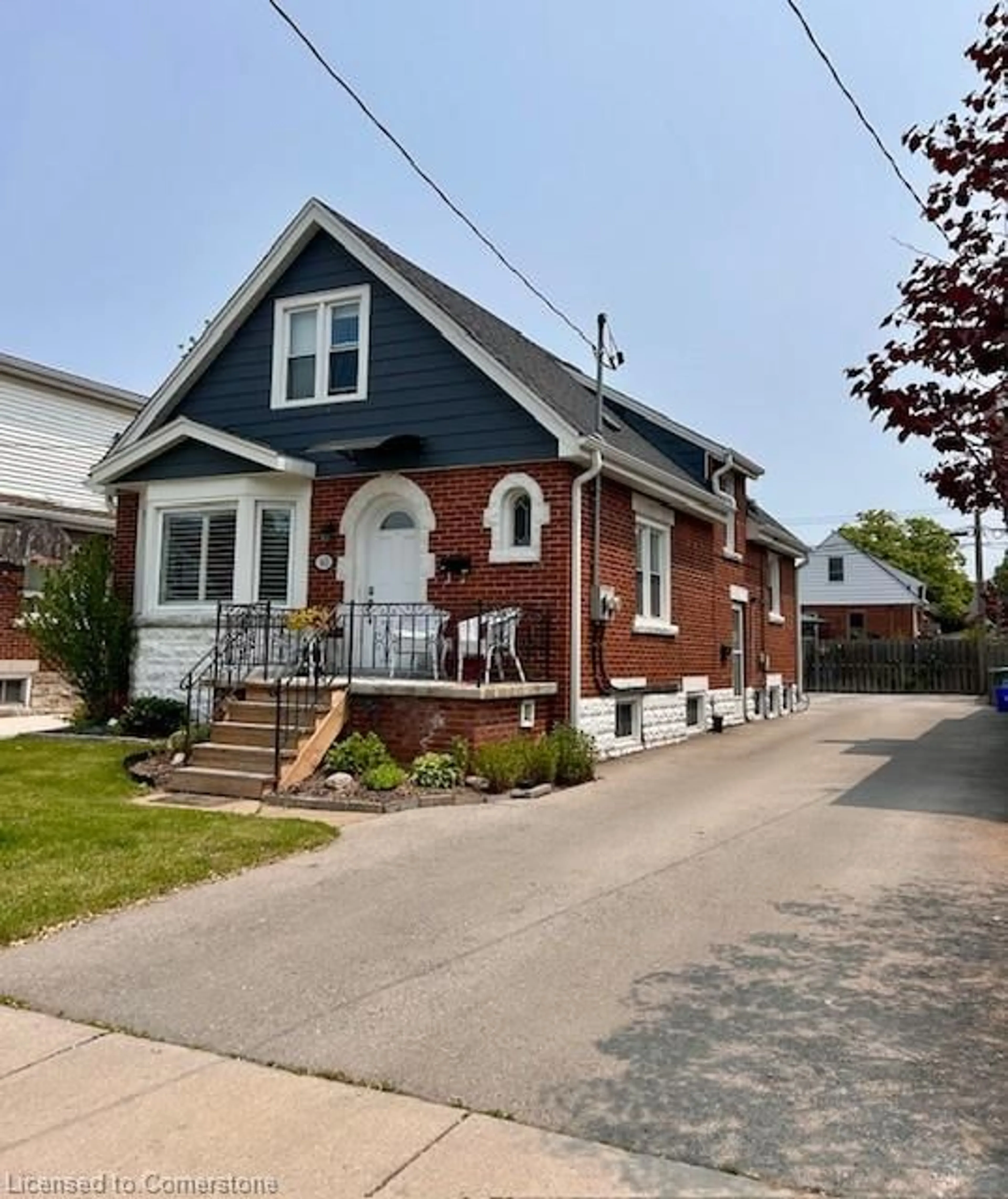 Home with brick exterior material, street for 143 Tuxedo Ave, Hamilton Ontario L8K 2S2