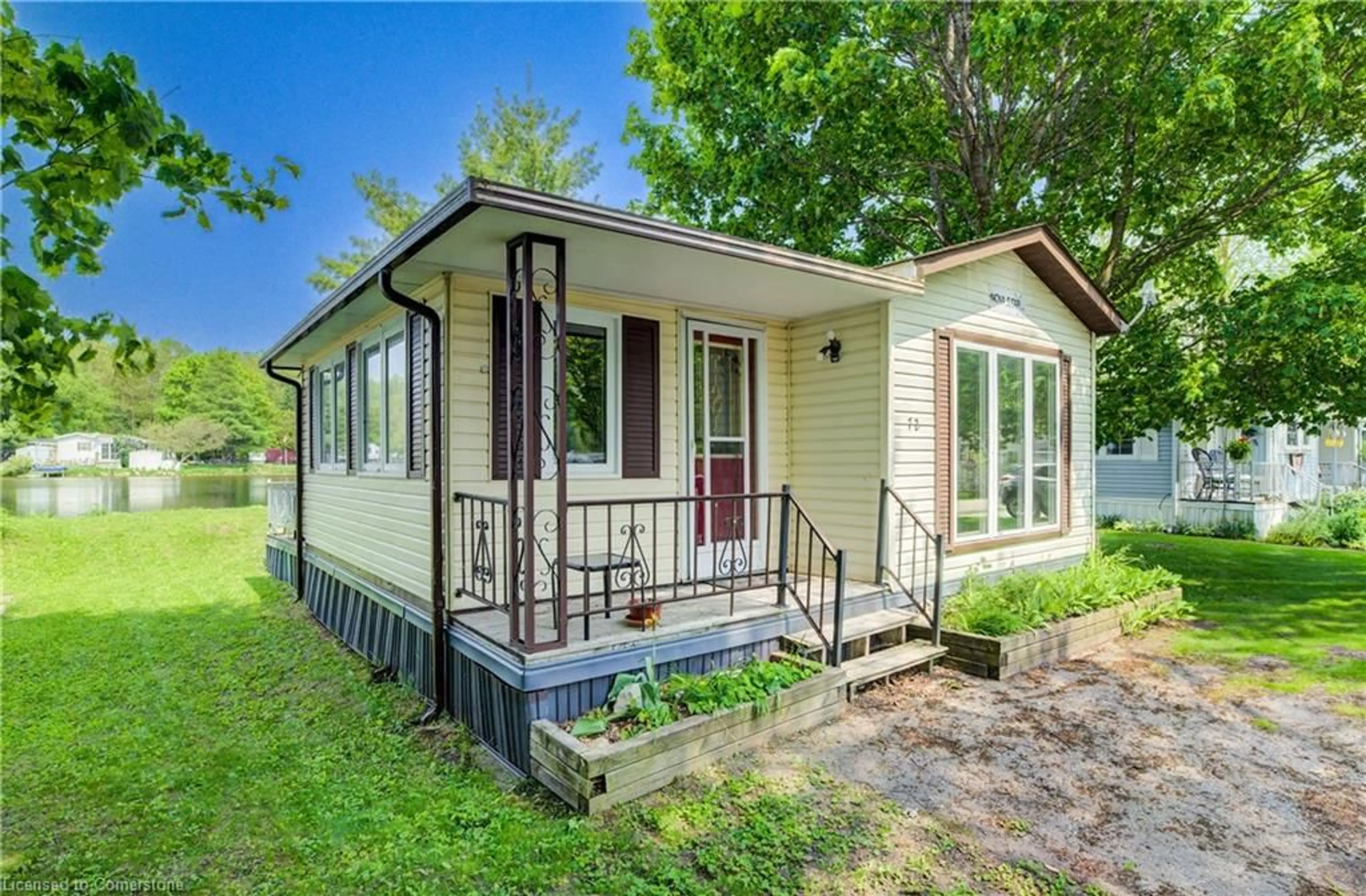 Home with vinyl exterior material, street for 7489 Side Road 5 #72 Lakeside, Wellington North Ontario N0G 2L0