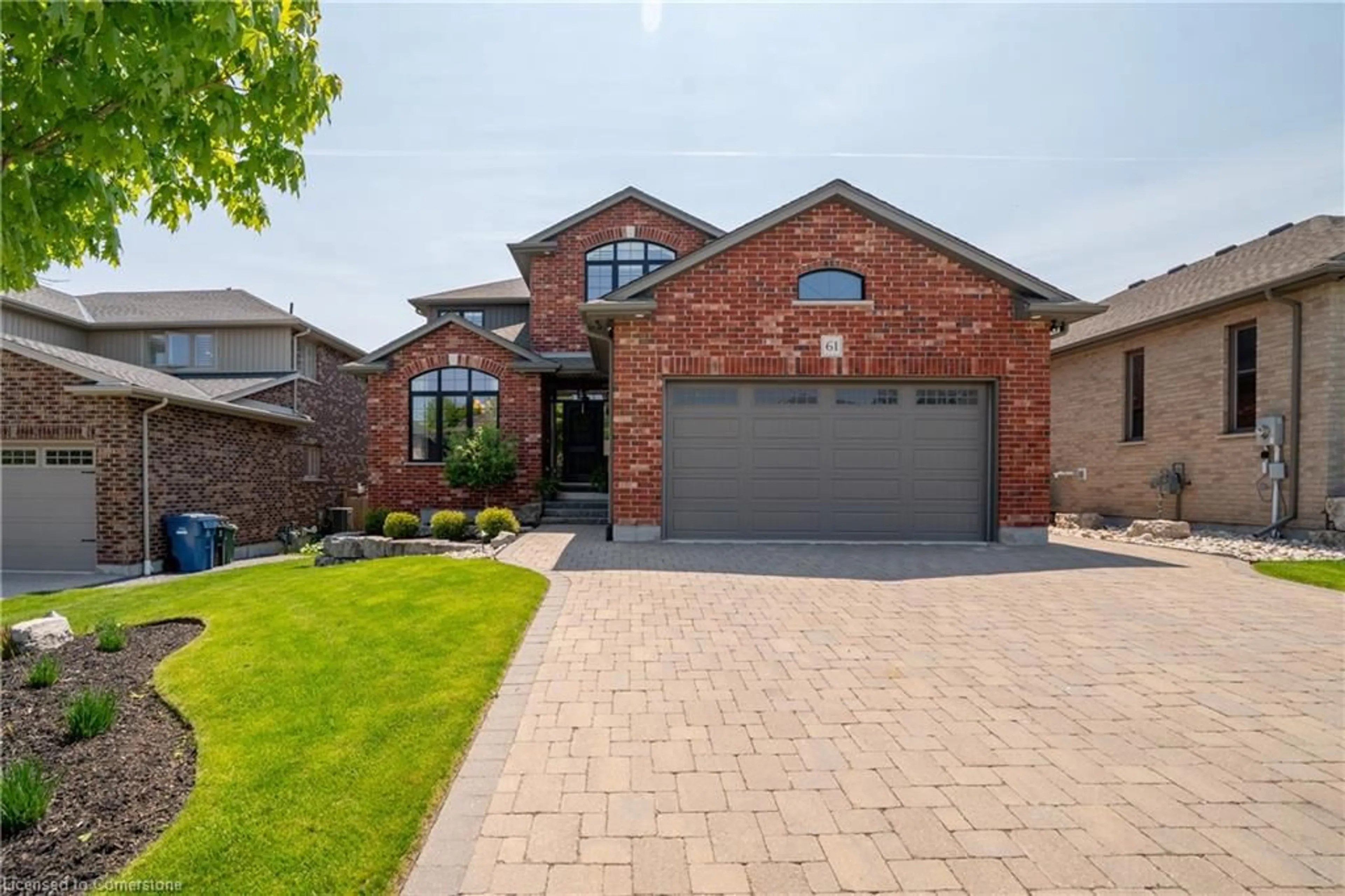 Home with brick exterior material, street for 61 Law Drive Dr, Guelph Ontario N1E 7J6