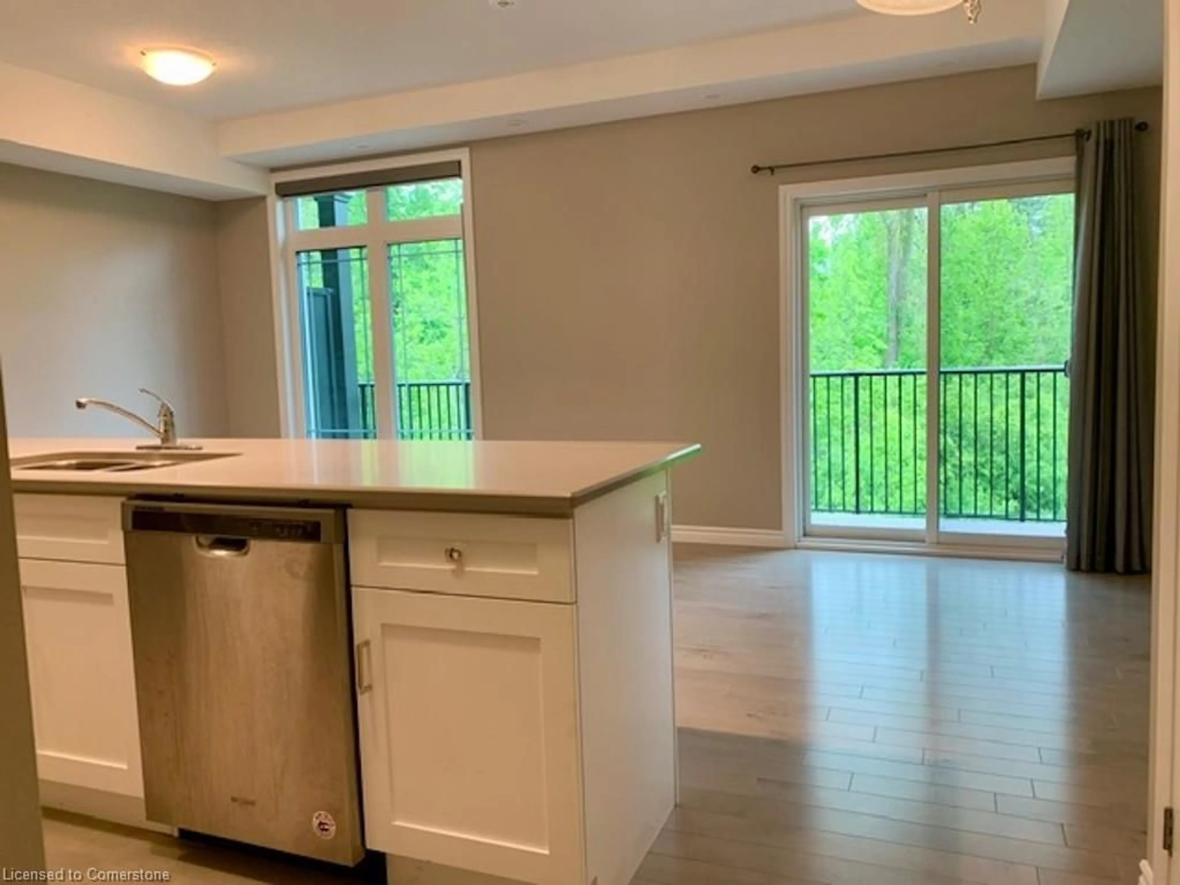 Open concept kitchen, wood/laminate floor for 107 Westra Dr #49, Guelph Ontario N1K 0A5