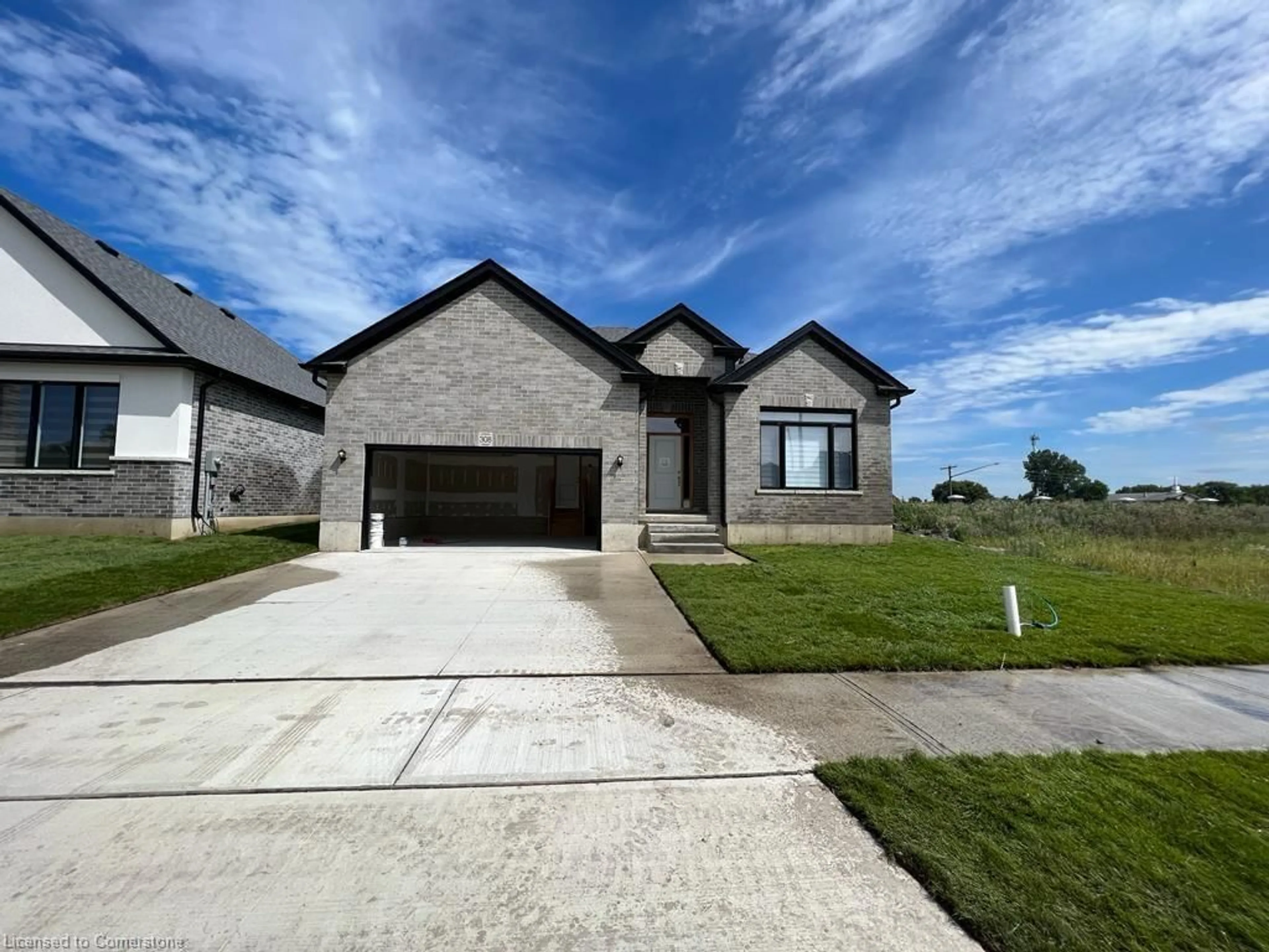 Home with brick exterior material, street for 312 Stathis Blvd, Sarnia Ontario N7G 0G7