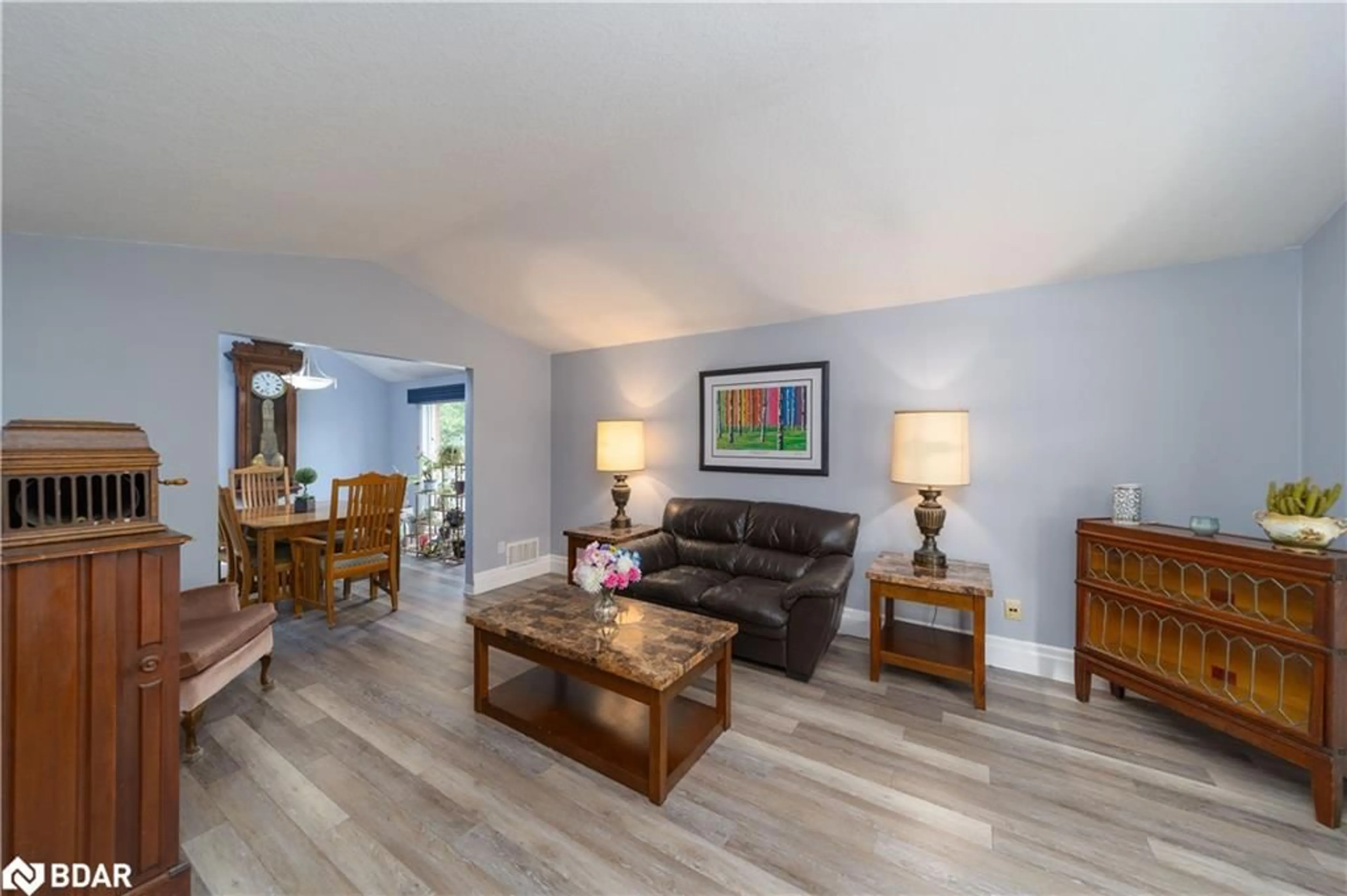 Living room with furniture, wood/laminate floor for 137 Queen Street, New Tecumseth Ontario L9R 1K4