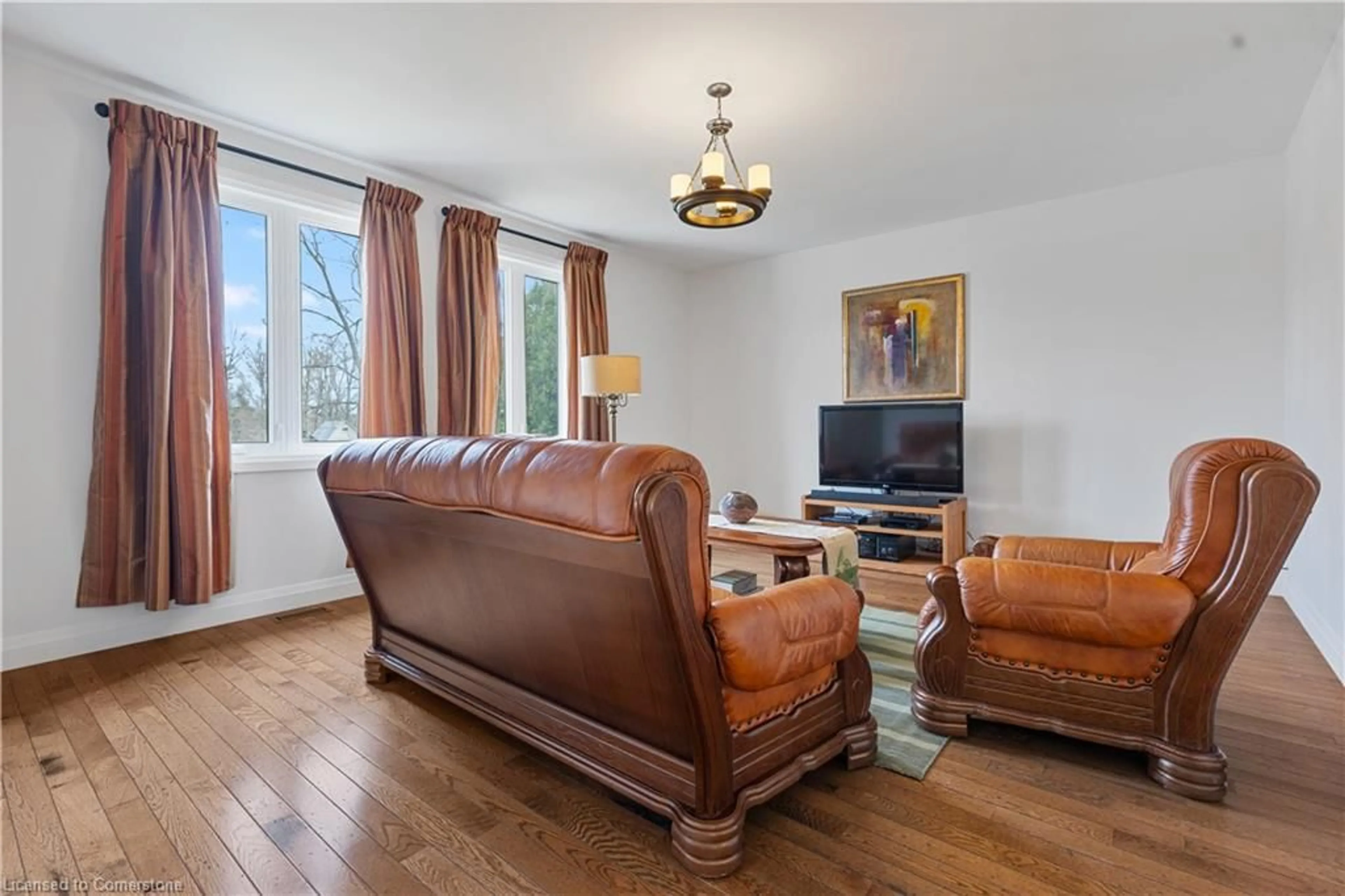 Living room with furniture, wood/laminate floor for 377 10th Concession Rd, Walsingham Ontario N0J 1G0