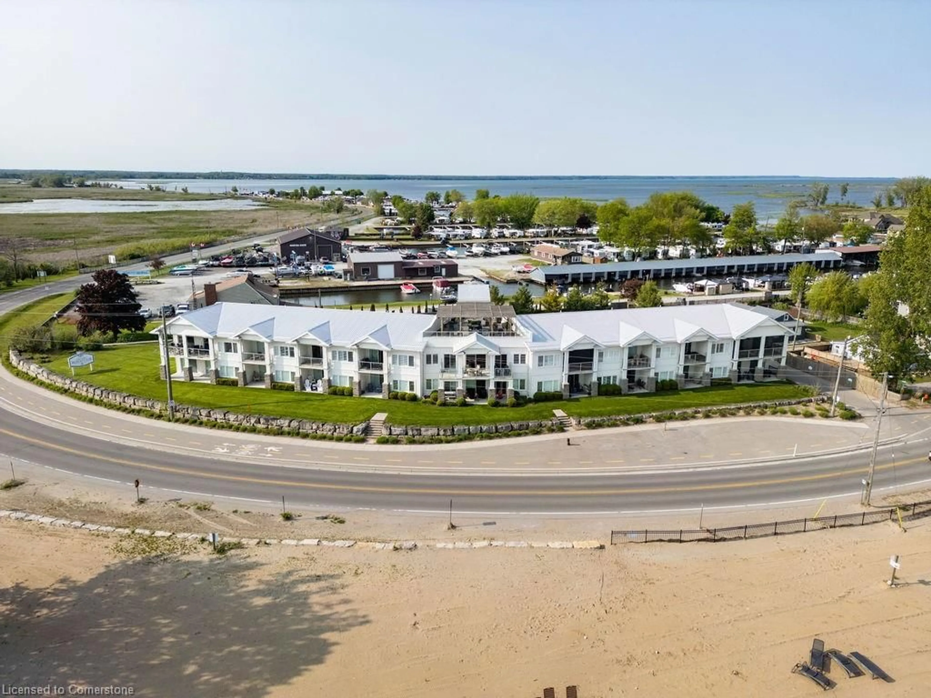 A pic from outside/outdoor area/front of a property/back of a property/a pic from drone, water/lake/river/ocean view for 12 Erie Blvd #203, Long Point Ontario N0E 1M0