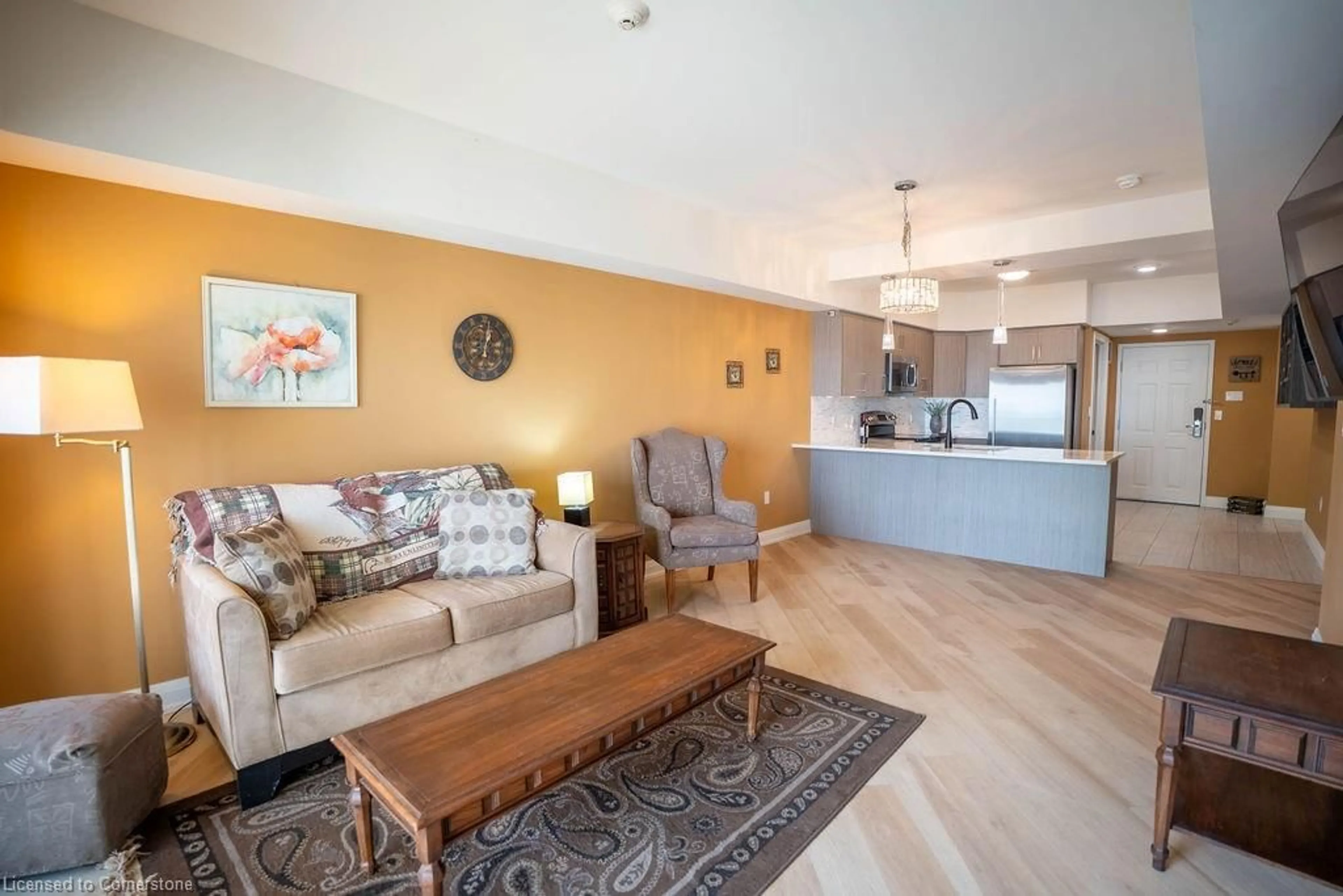 Living room with furniture, wood/laminate floor for 12 Erie Blvd #203, Long Point Ontario N0E 1M0