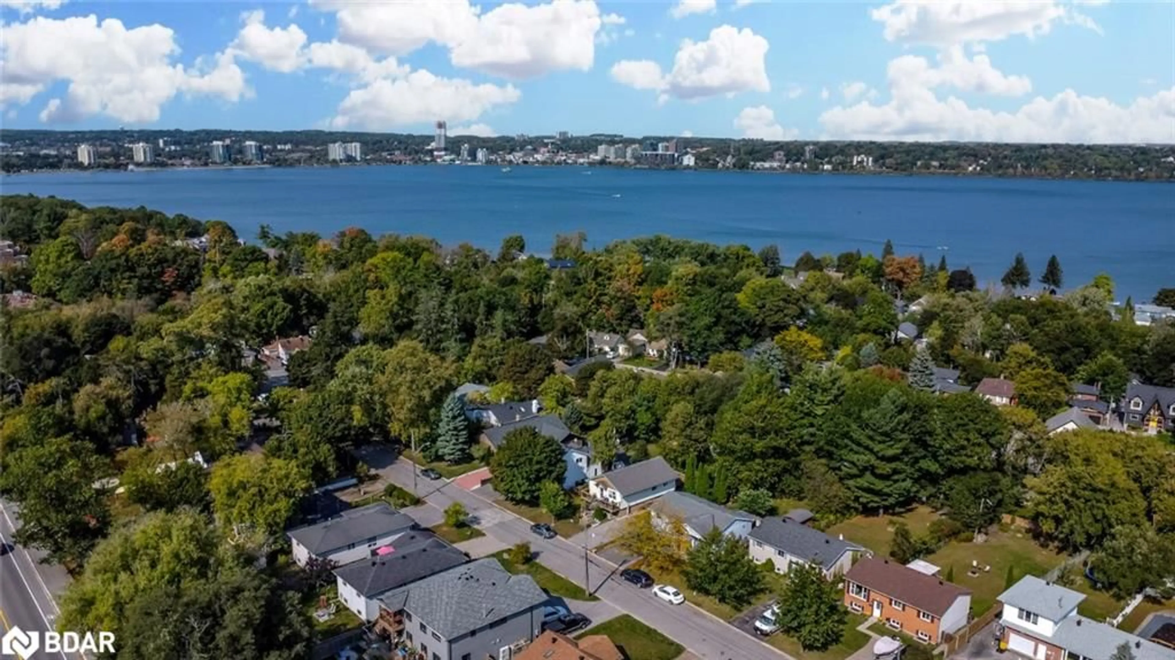 A pic from outside/outdoor area/front of a property/back of a property/a pic from drone, water/lake/river/ocean view for 210 Southview Rd, Barrie Ontario L4N 3X7
